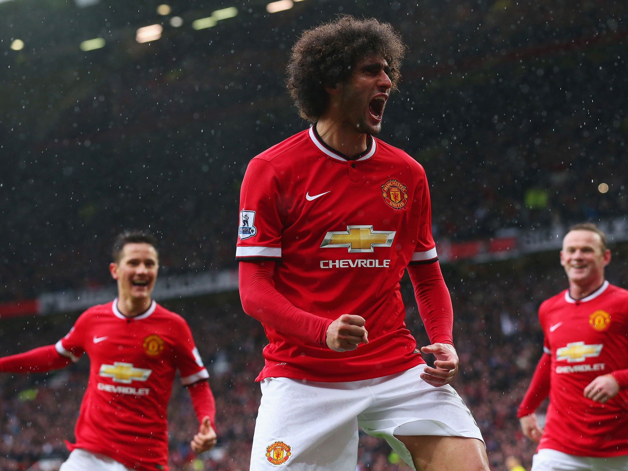 Marouane Fellaini celebrates his goal for United