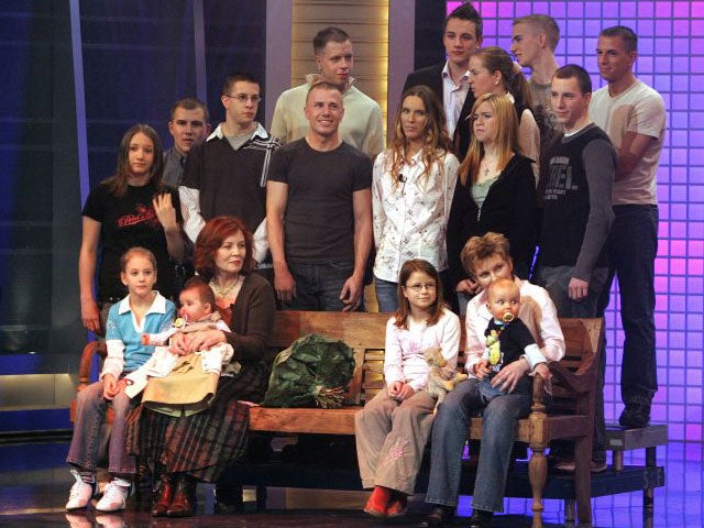 Raunigk, bottom row third left, pictured on a chat show with her children and grandchildren