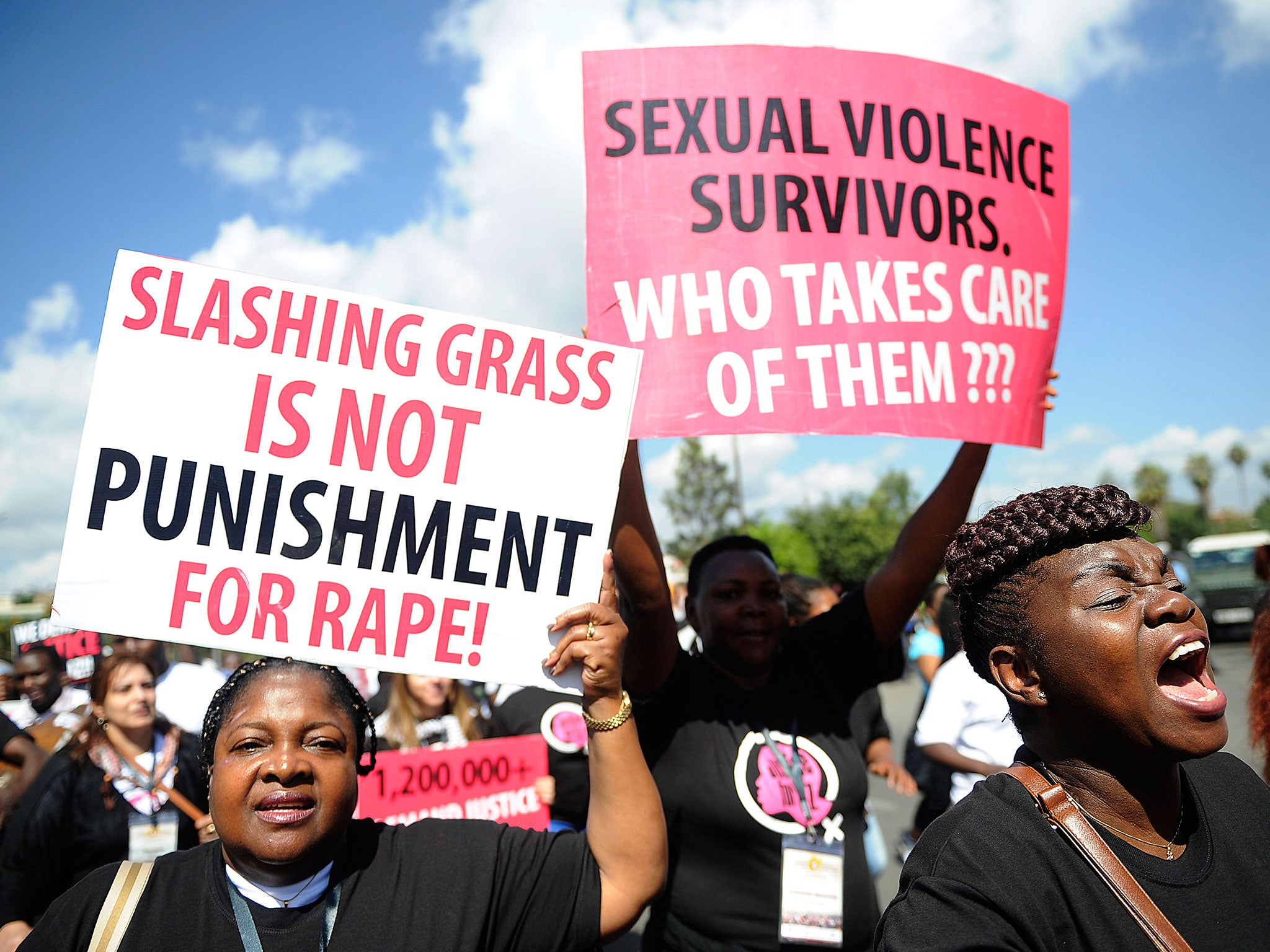 Kenyan protestors march towards the police headquarters on October 31, 2013 in Nairobi to deliver a petition of over a million names demanding justice after men accused of brutally gang raping a schoolgirl cut grass as punishment. The ferocious attack on