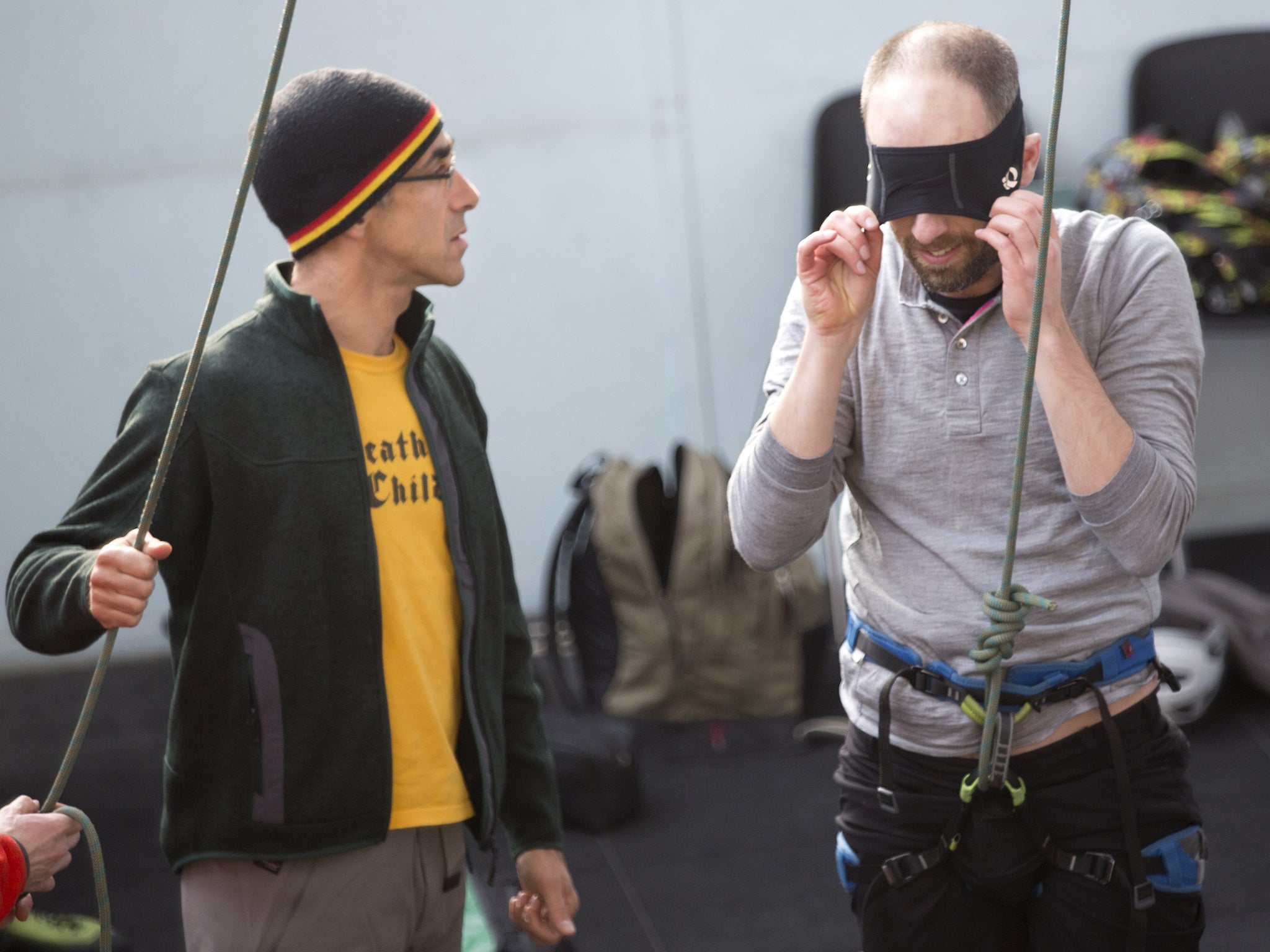 Writer Simon Usborne puts on a blindfold before he begins his climb