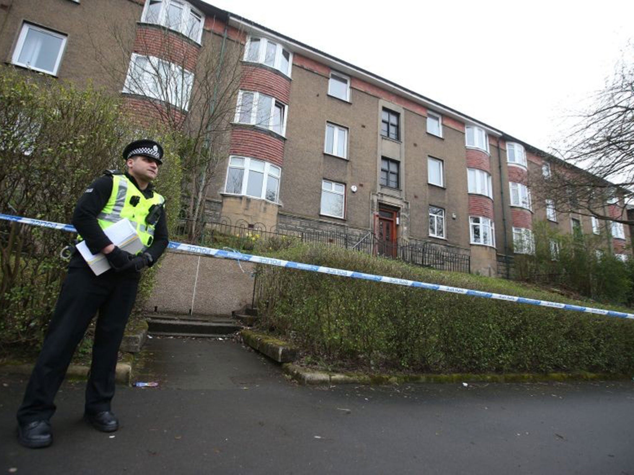 Police outside flats Dorchester Avenue in Glasgow, which was visited by missing student Karen Buckley in the early hours of Sunday.