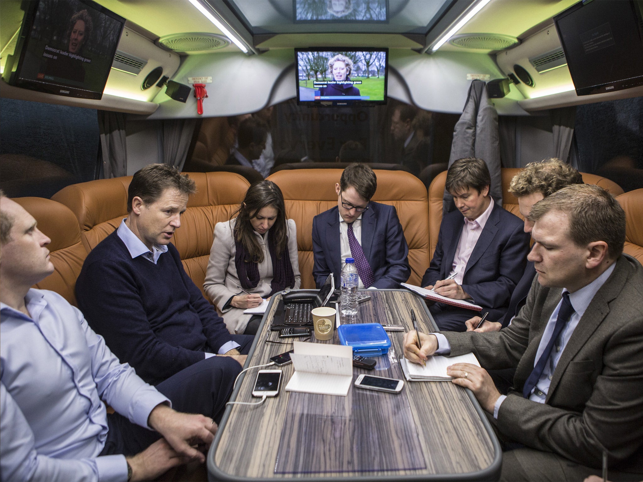 Ready for battle: Oliver Wright (back right) listens to Nick Clegg