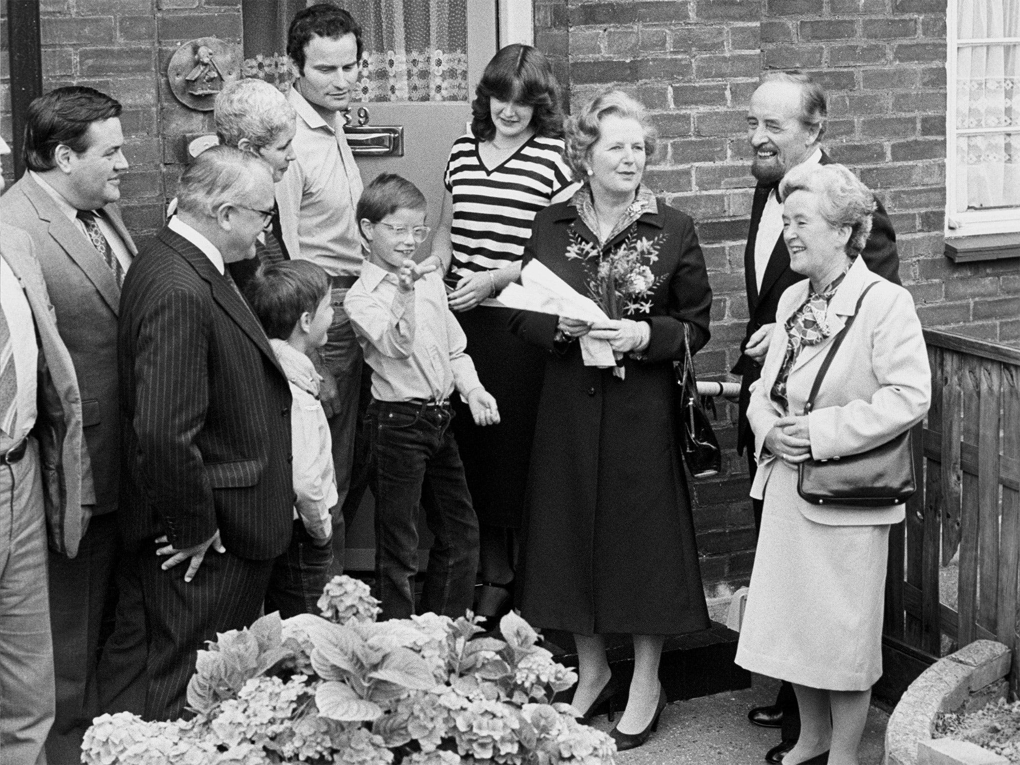 Margaret Thatcher with the new owners of a property in Essex which was sold for just over £8,000 in 1980