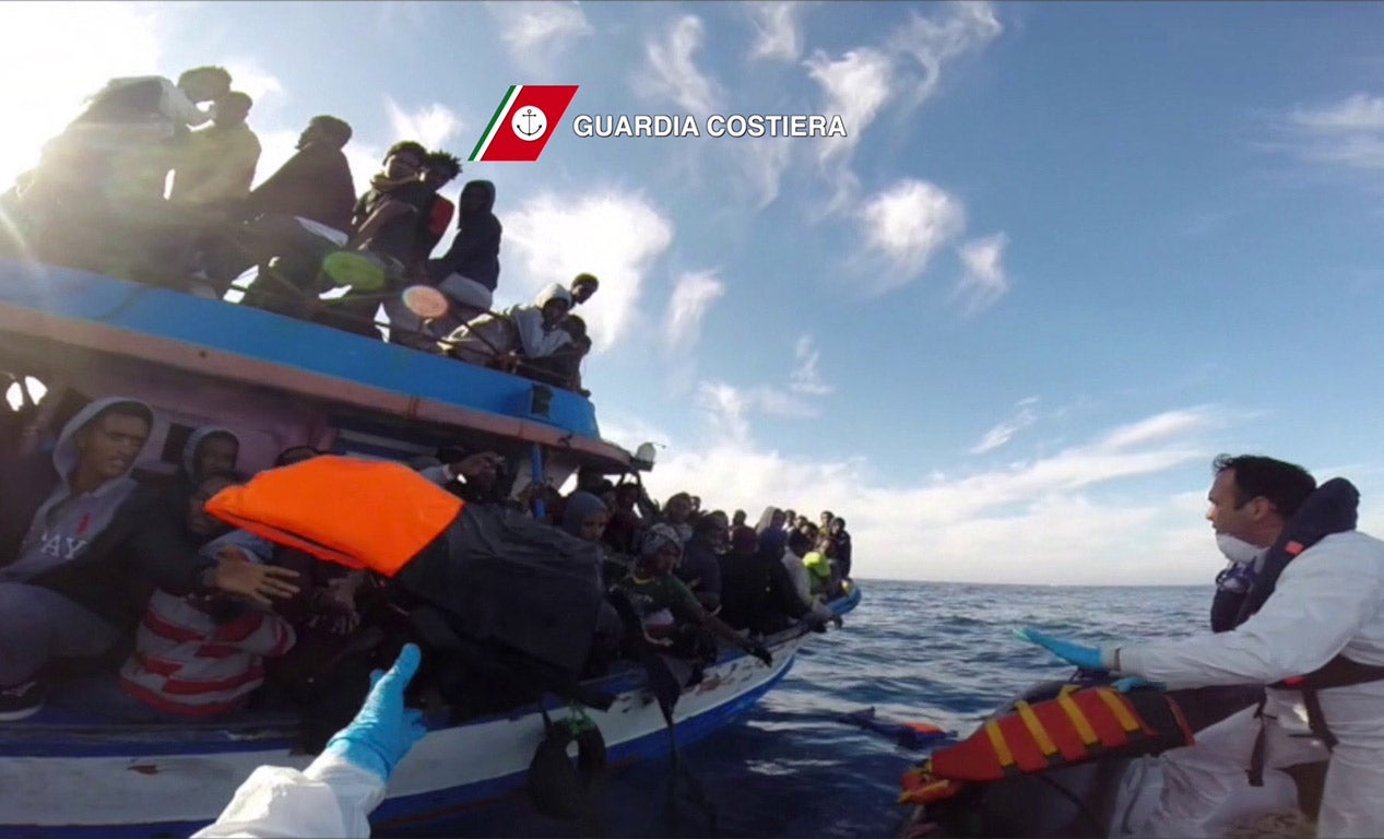 A boat of the Italian Guardia Costiera takes part in a rescue operation of migrants off the coast of Sicily (Getty)