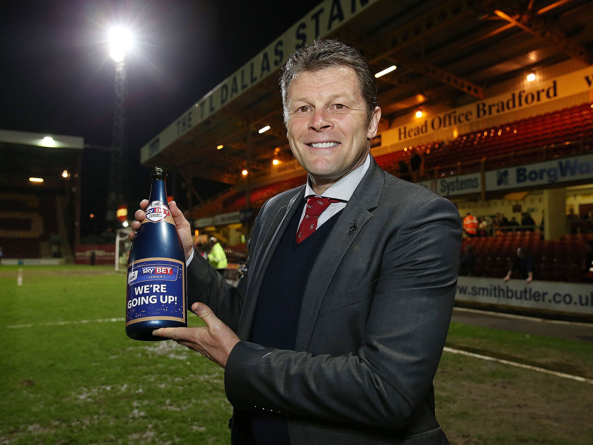 Manager Steve Cotterill celebrates Bristol City's promotion to the Championship