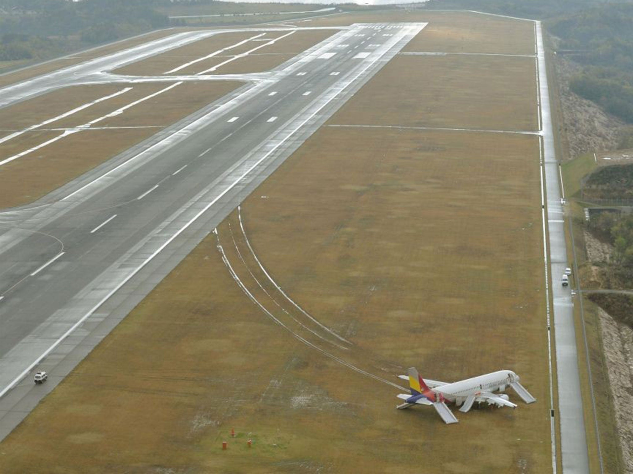 The Asiana Airlines passenger slid on to an embankment