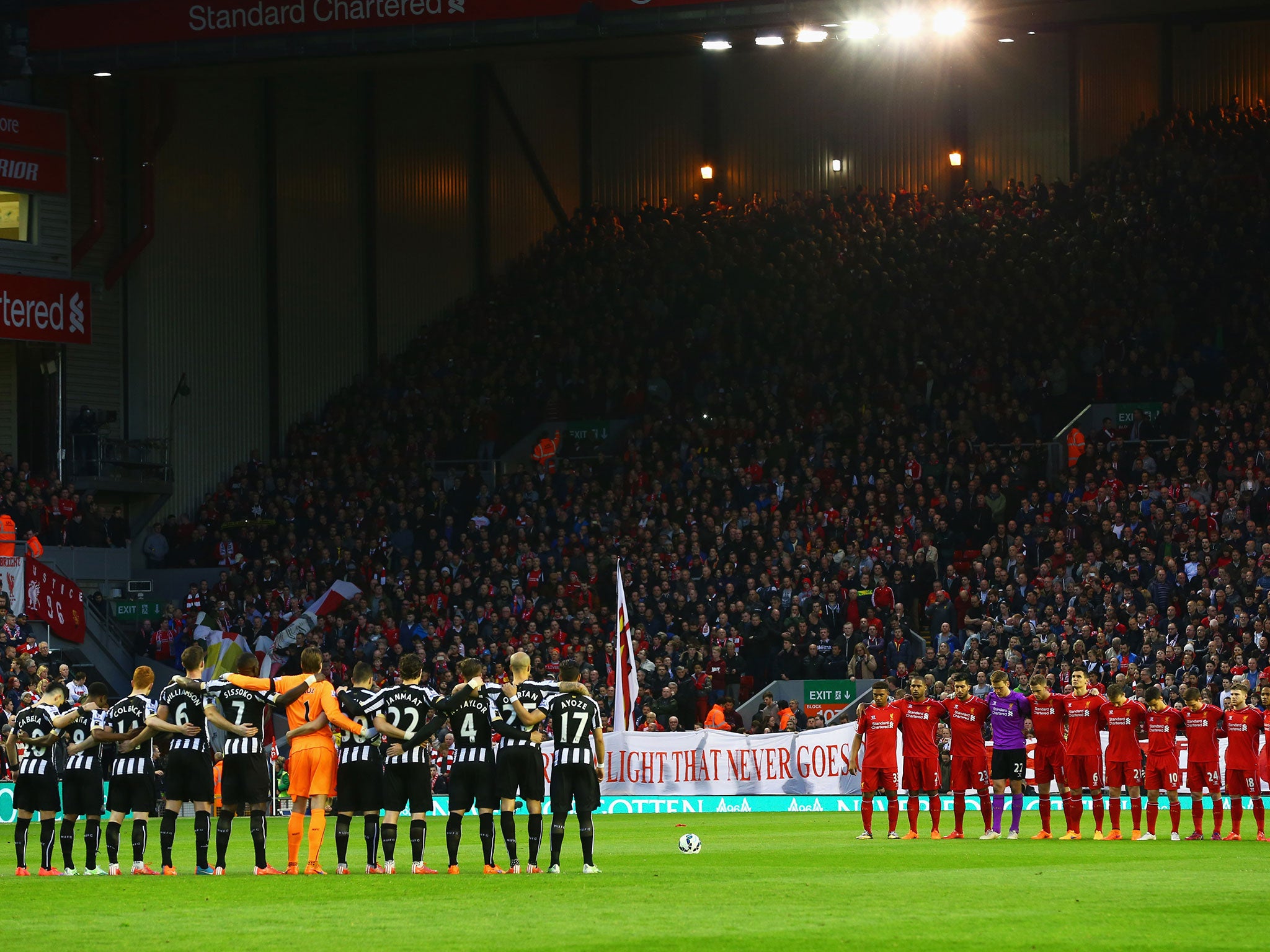 Liverpool and Newcastle players held a minute's silence at Anfield on Monday night