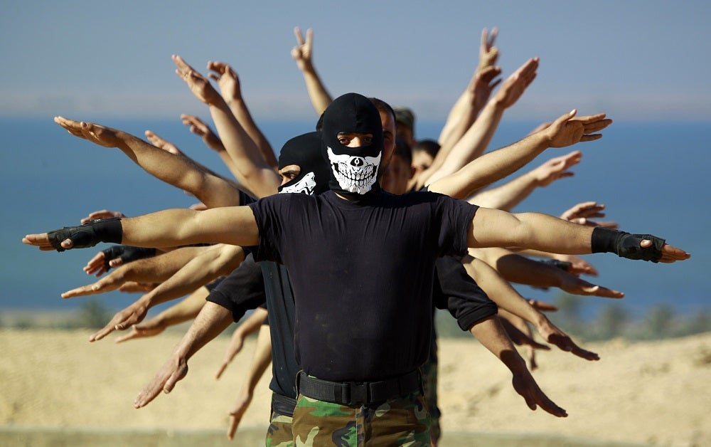 Fighters from the Iraqi Imam Ali Brigade take part in a training exercise in Najaf, Iraq