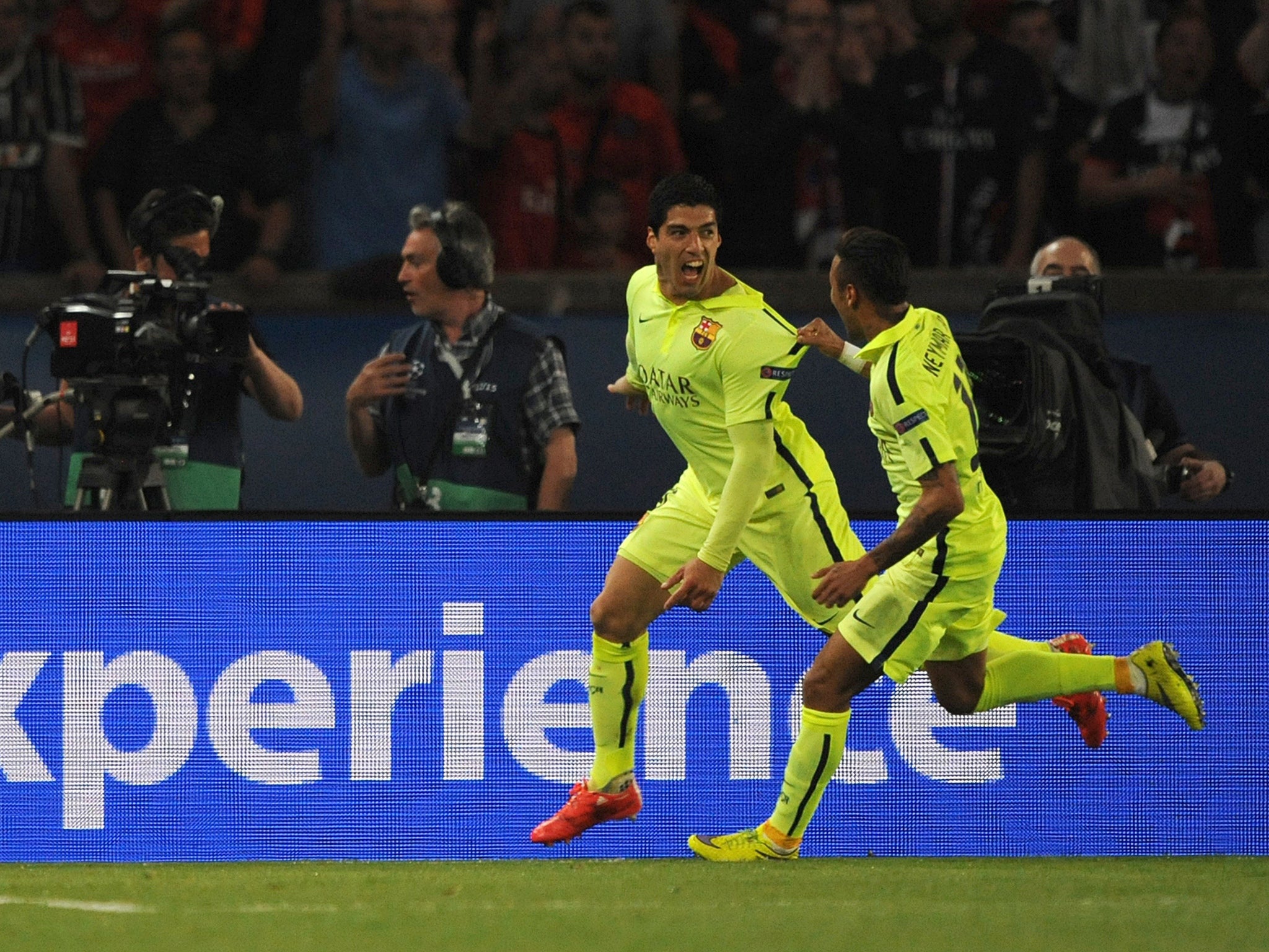 Luis Suarez celebrates his first goal with Neymar