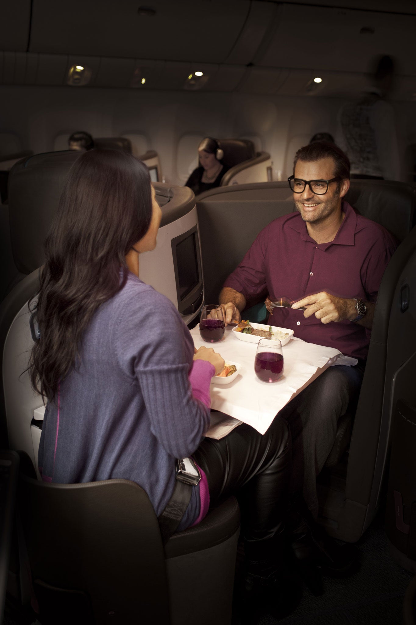 Air New Zealand passengers dining in its business premier class