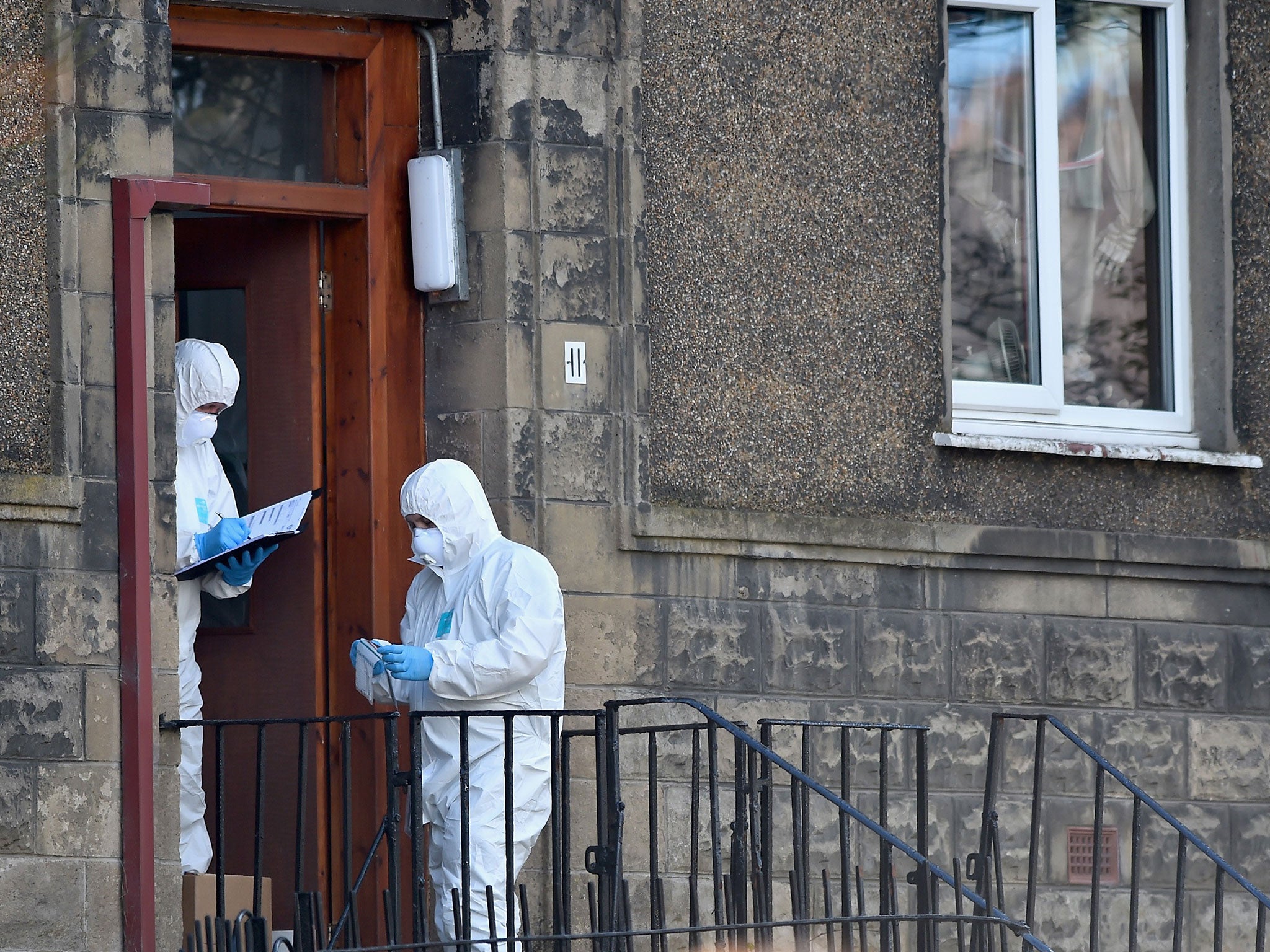 Police search the flat in Dorchester Avenue, where Karen Buckley was last seen