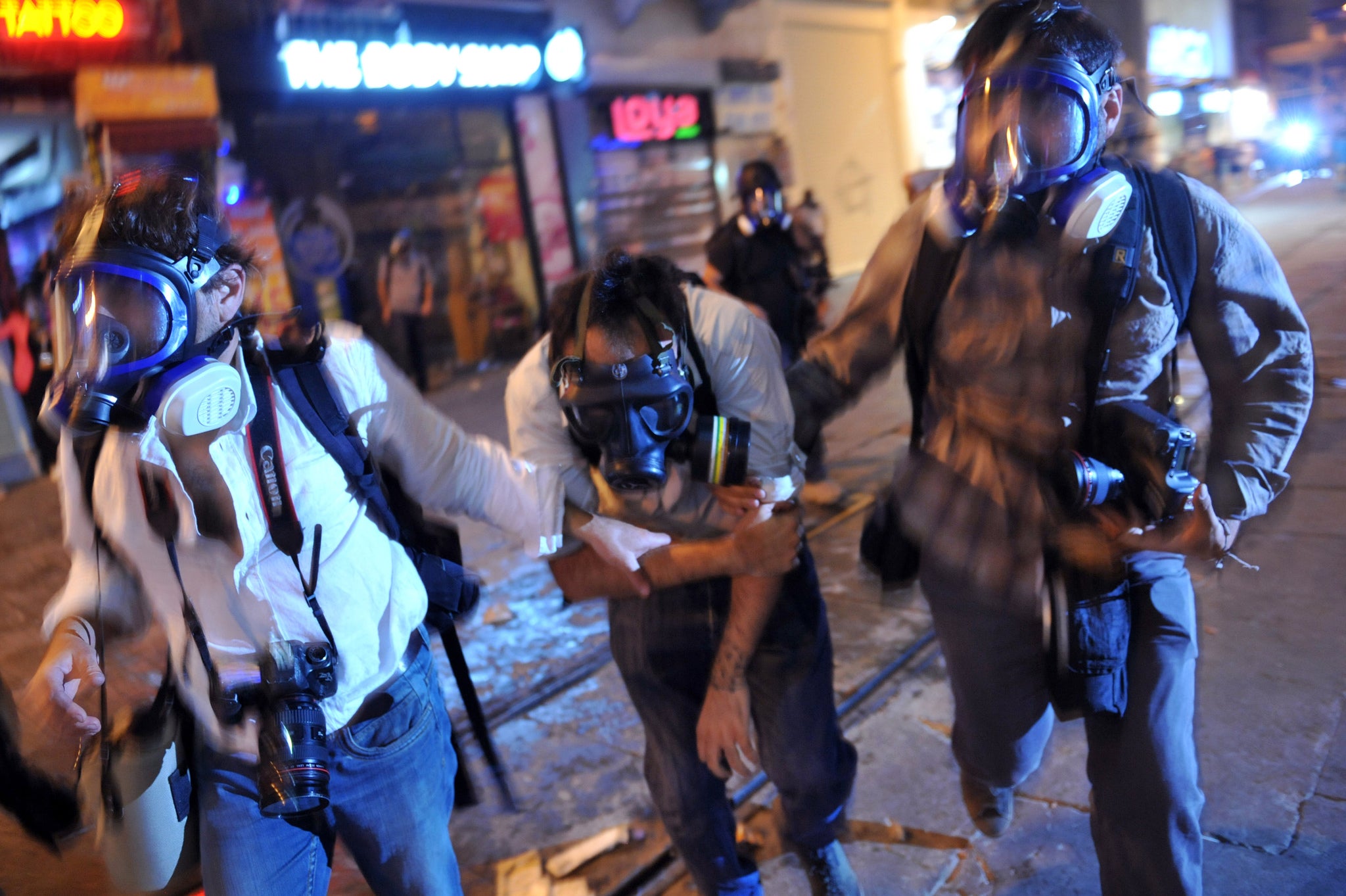 Photographers help their colleague Ufuk Kosar after he was beaten by riot police during a protest in the Turkish capital, Istanbul.