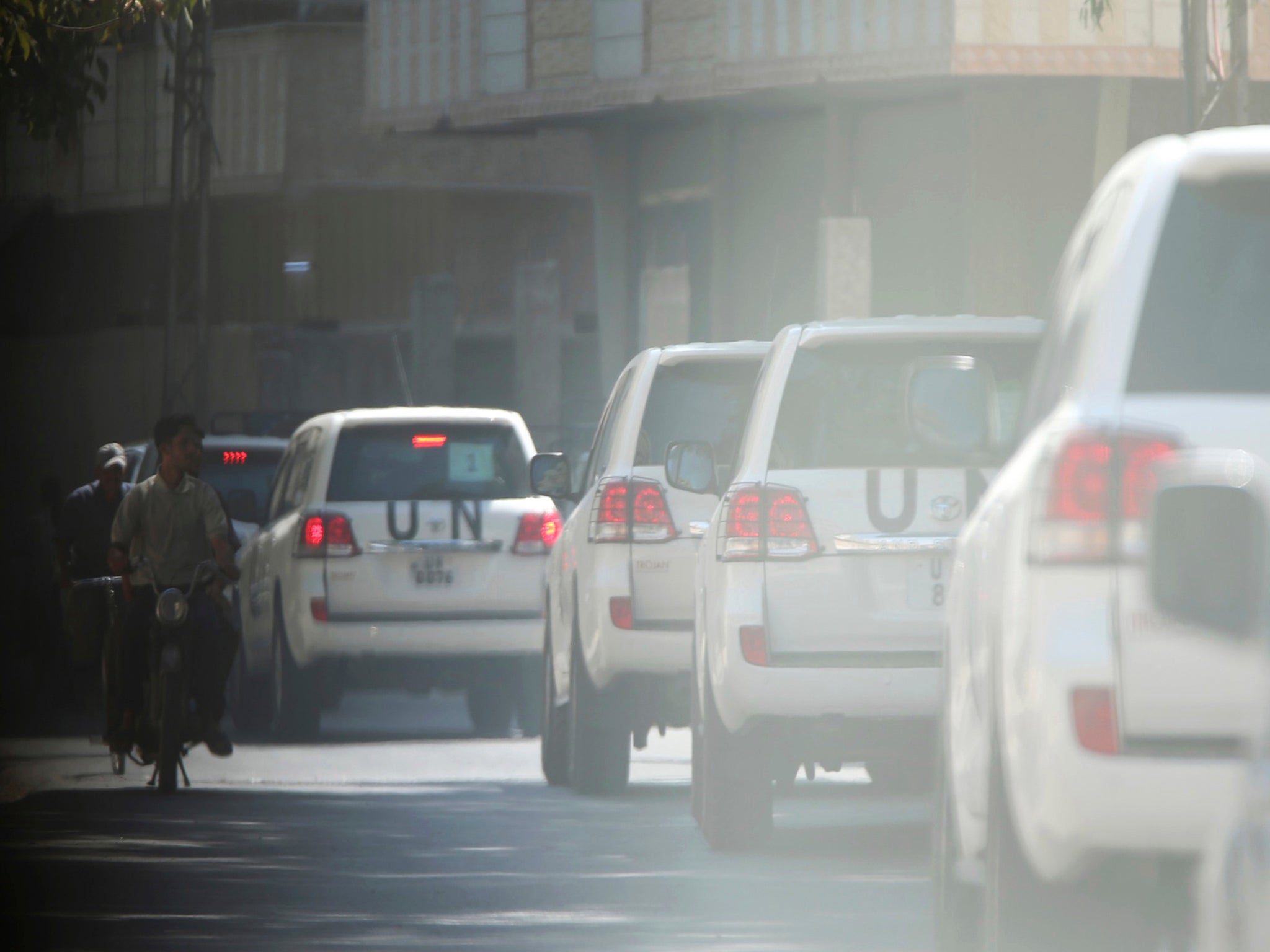 UN vehicles in Syria after experts were permitted in to inspect allegations of chemical weapons attacks on civilians in the summer of 2013