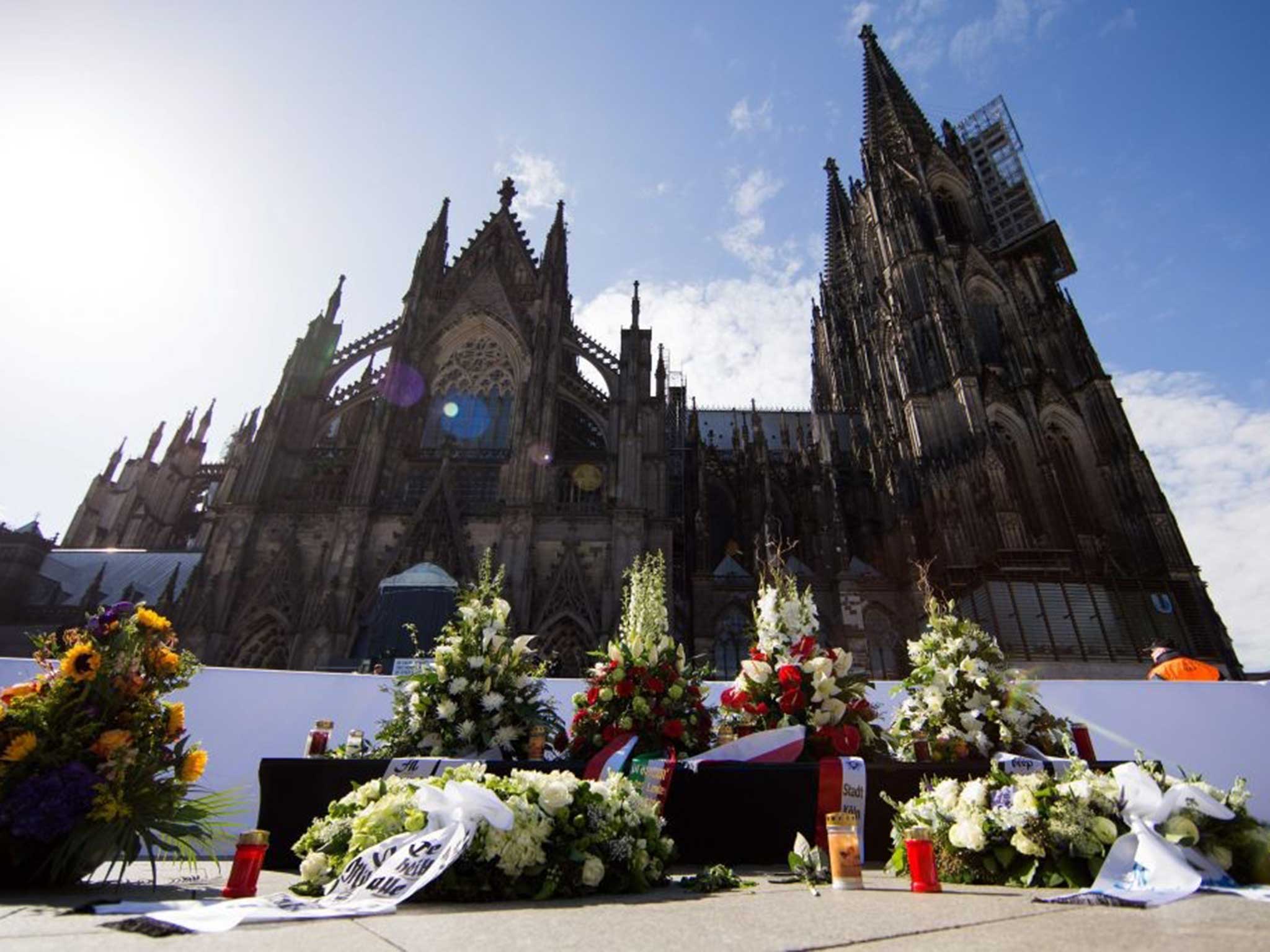 Floral tributes outside Cologne cathedral before a memorial service