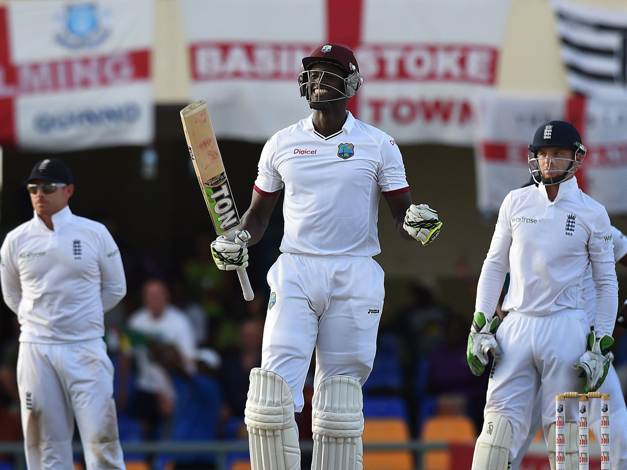 Jason Holder celebrates reaching his maiden Test century