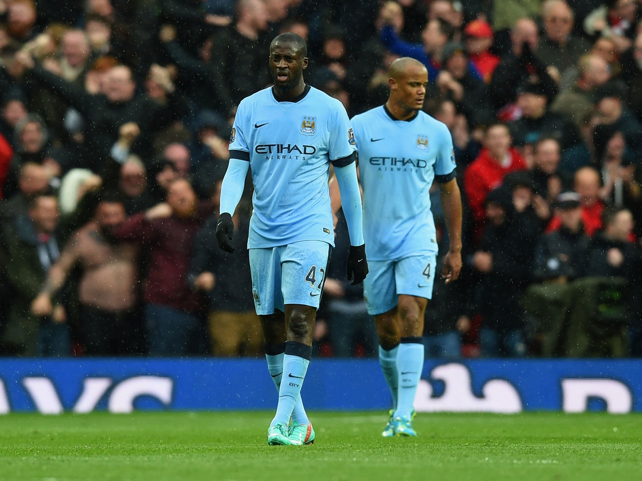 Yaya Toure and Vincent Kompany look dejected during the Manchester derby defeat