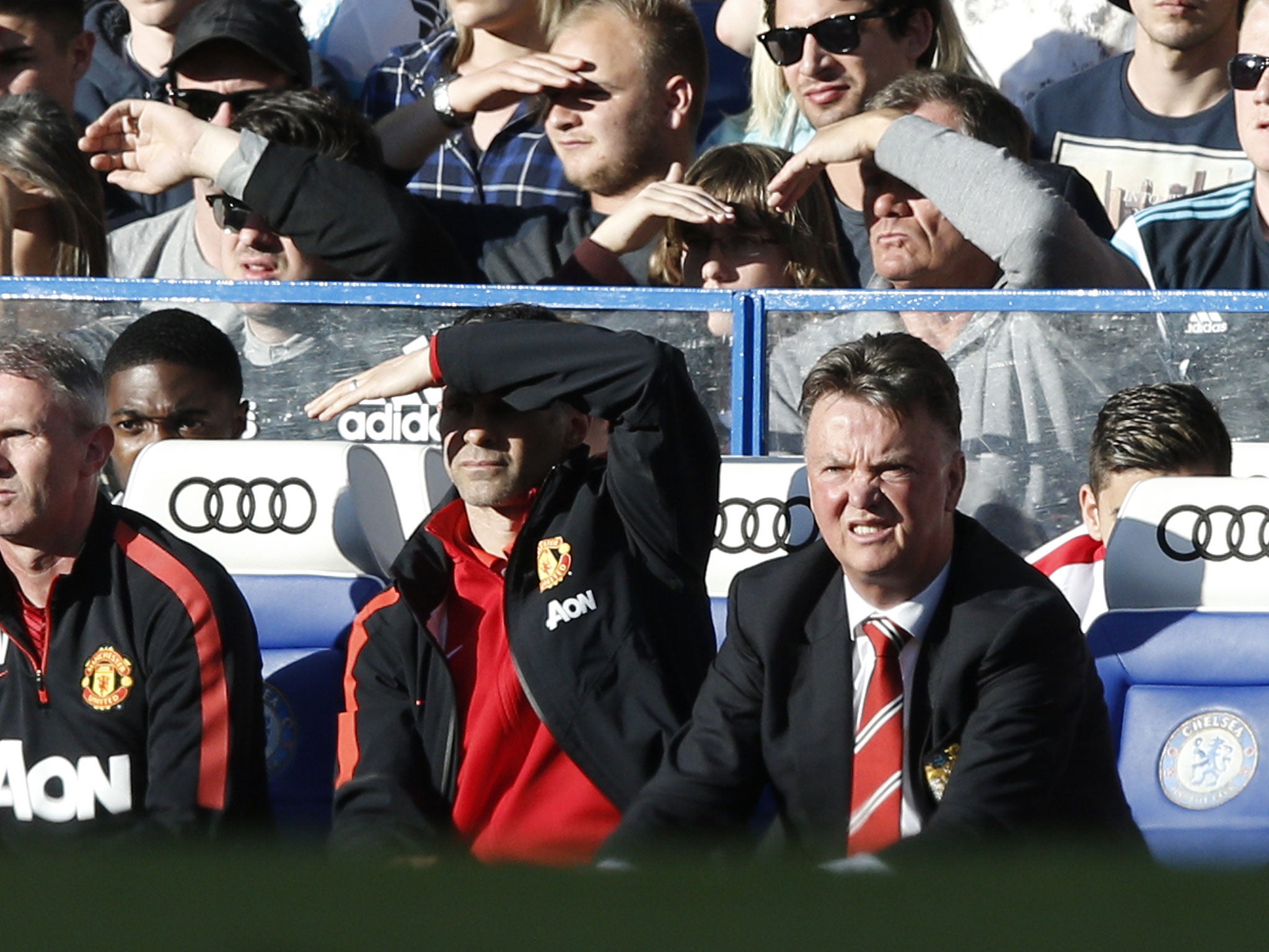 Louis van Gaal and Ryan Giggs struggle to see in the sun