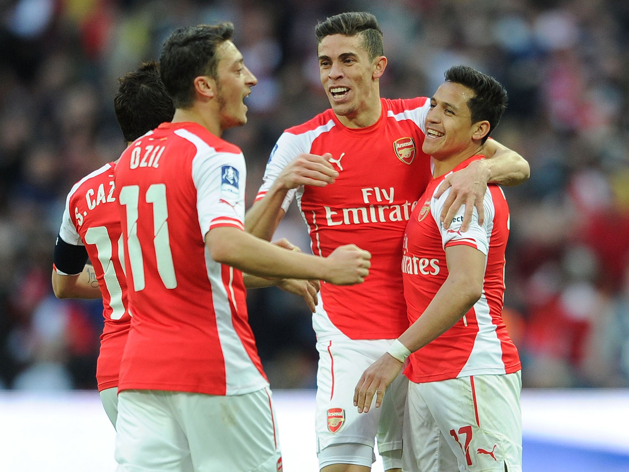 Arsenal players celebrate beating Reading in the FA Cup semi-final