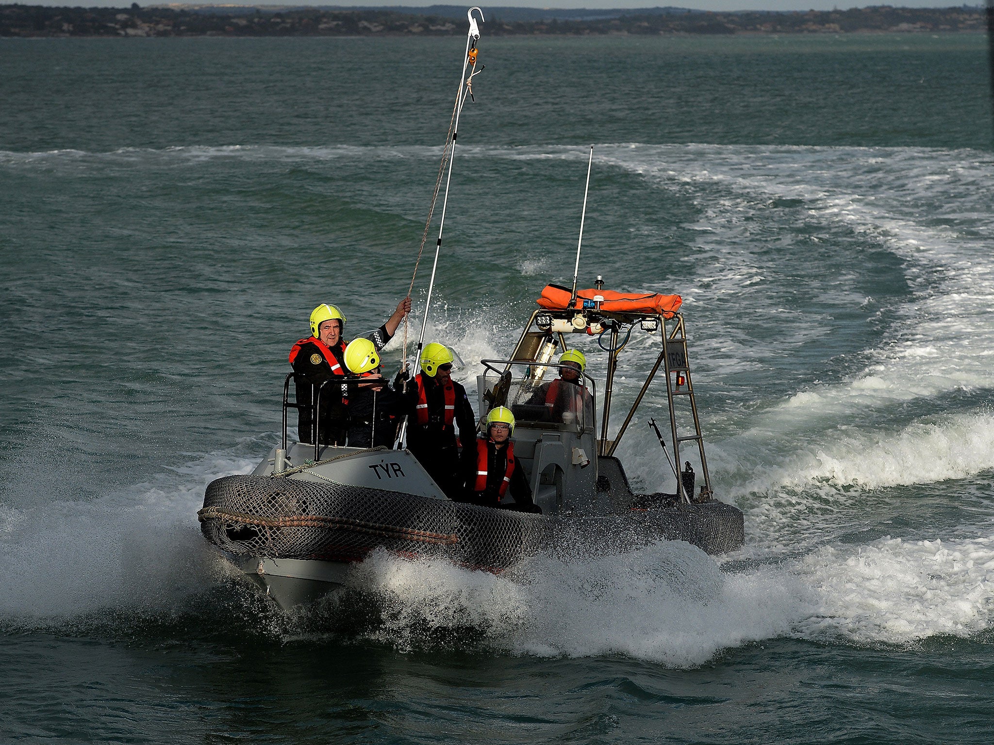 Rescuers train to board the Iceland's patrol vessel Tyr, on February 6, 2015 in the port of Pozzallo in Sicily