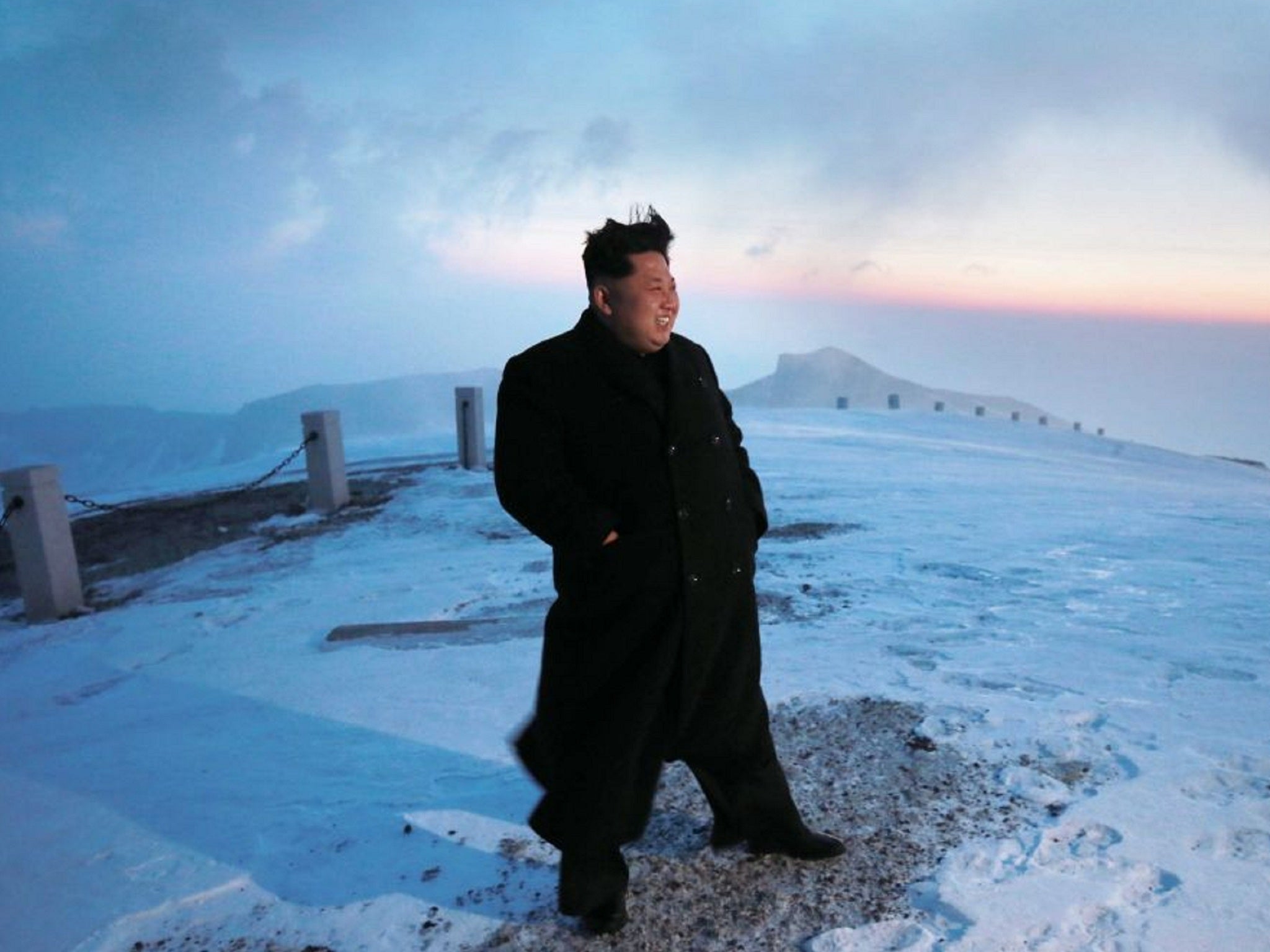 Kim taking in the view from the highest point in North Korea