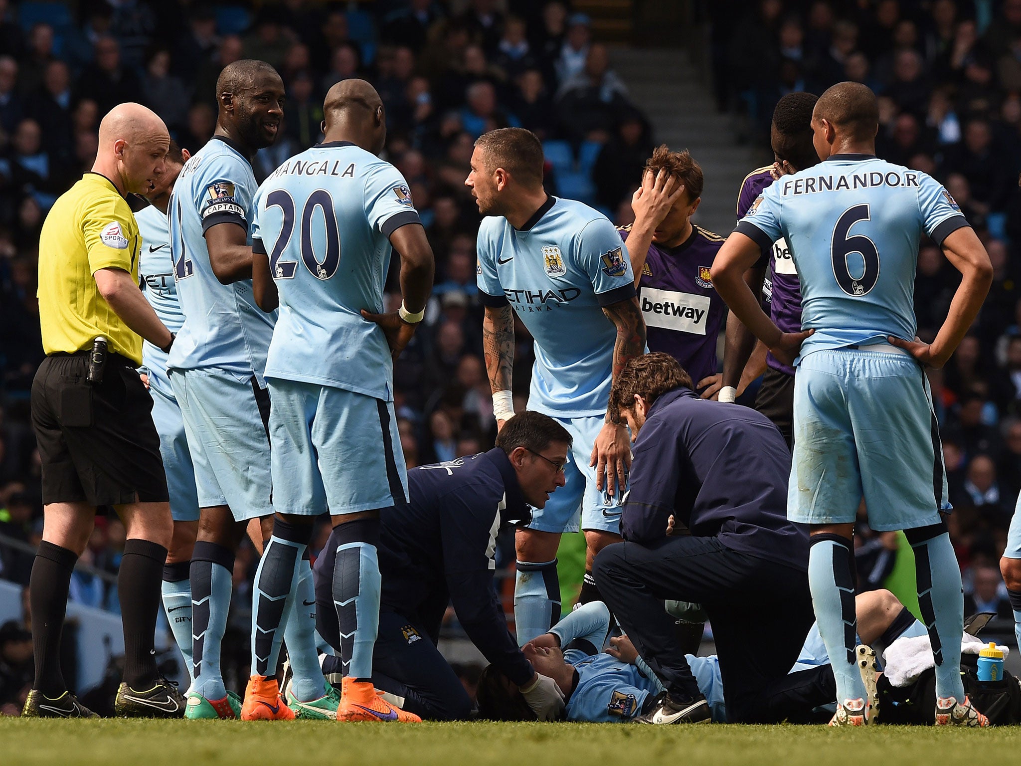 David Silva is treated after clashing with Kouyate