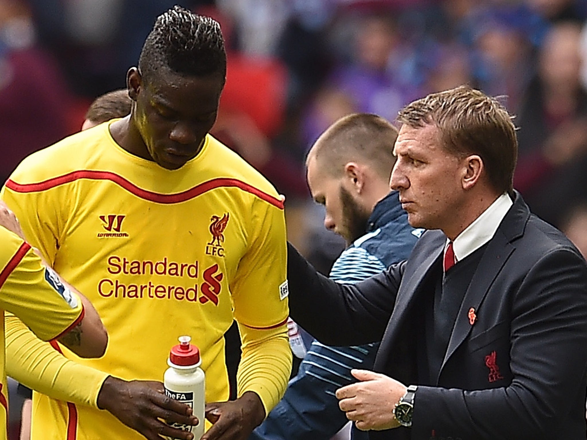 Brendan Rodgers talks with Mario Balotelli during the FA Cup semi-final