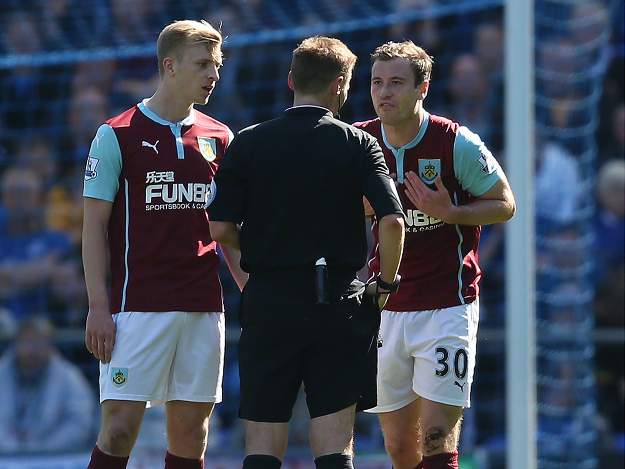 Ashley Barnes of Burnley (right) appeals to referee Michael Jones