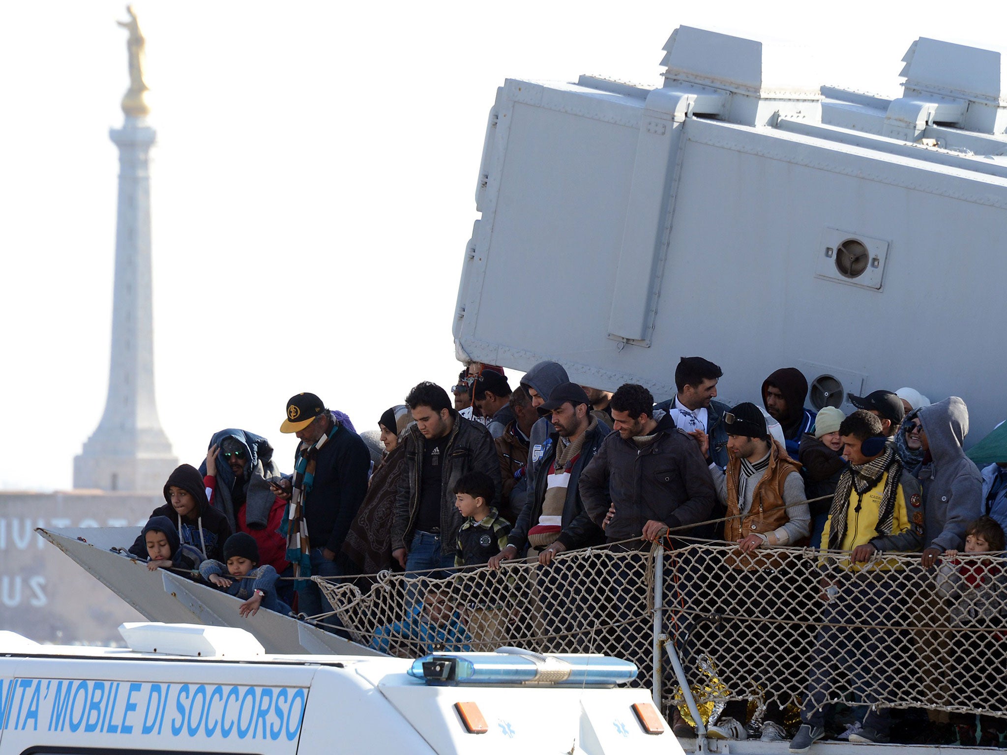 A boat transporting migrants arrives in the port of Messina after a rescue operation at sea