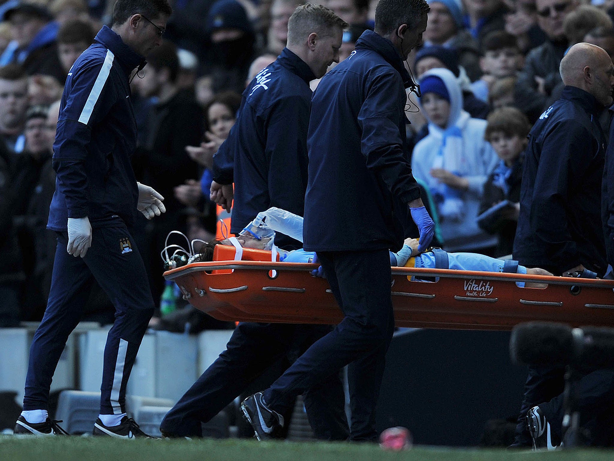 David Silva is carried off the pitch during the win over West Ham