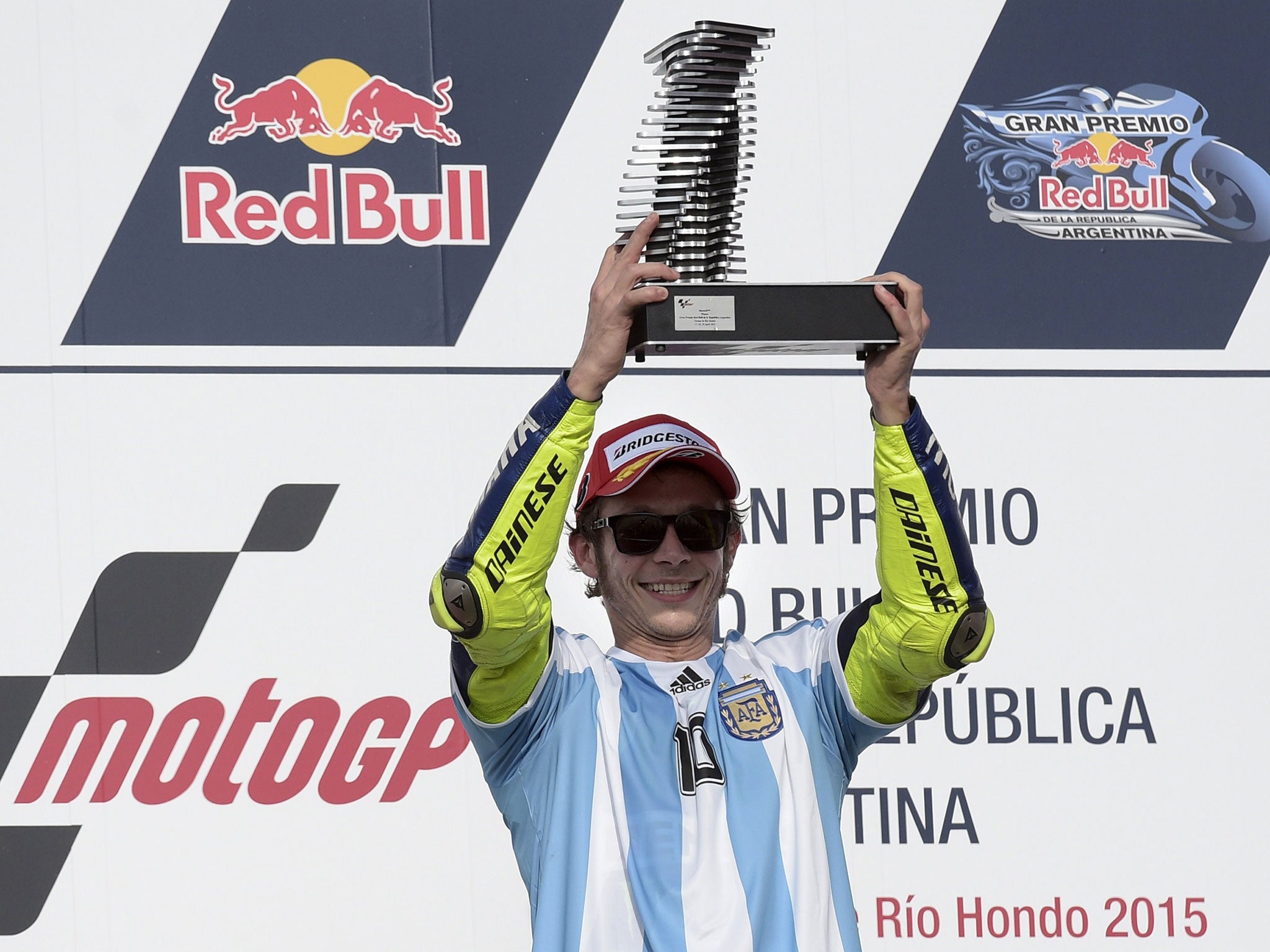 Valentino Rossi celebrates victory in Argentina wearing a Diego Maradona shirt