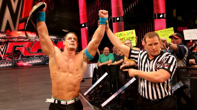 John Cena celebrates his victory over Kane