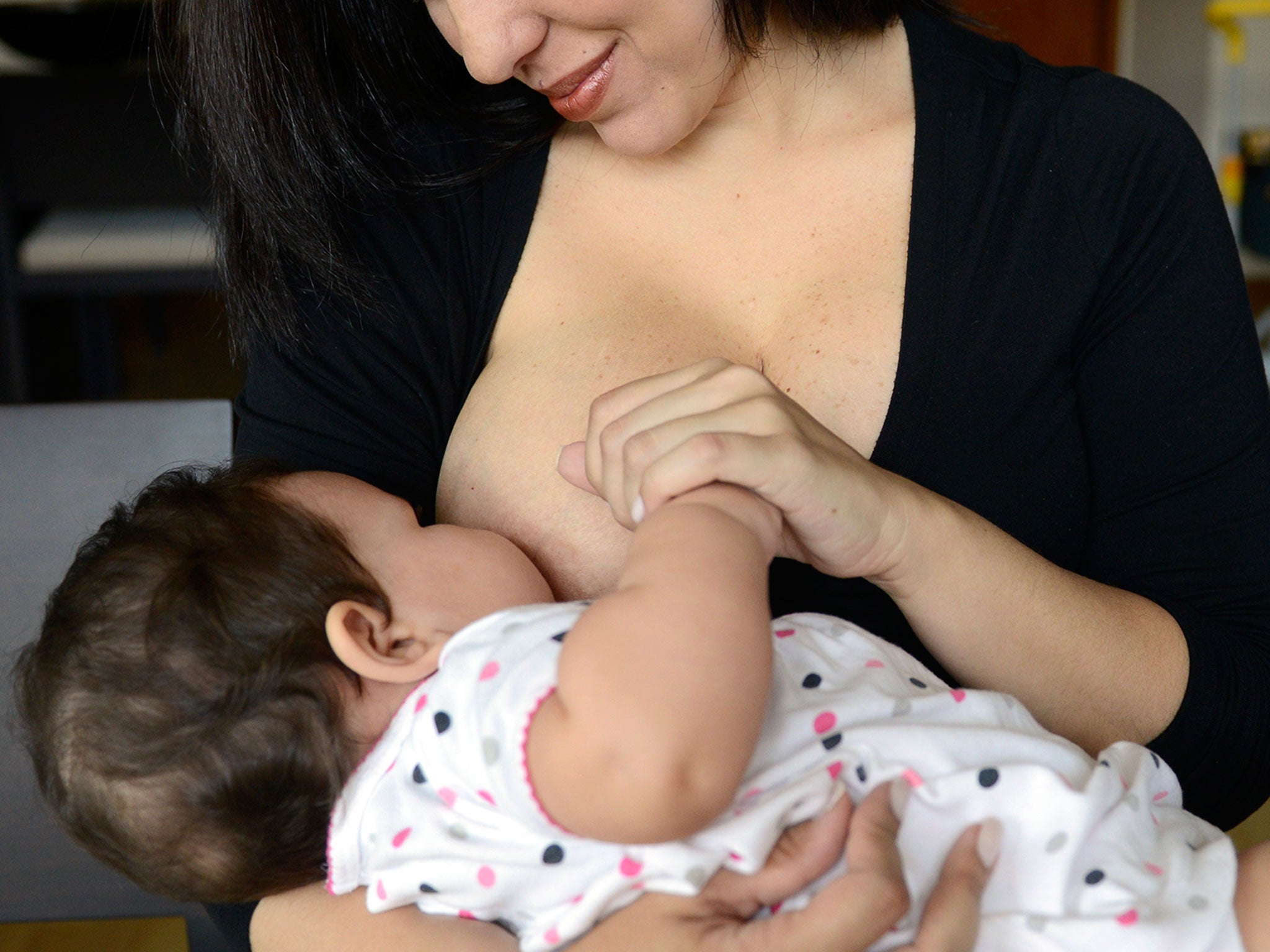 A photo of a woman breastfeeding on the toilet has sparked an online debate