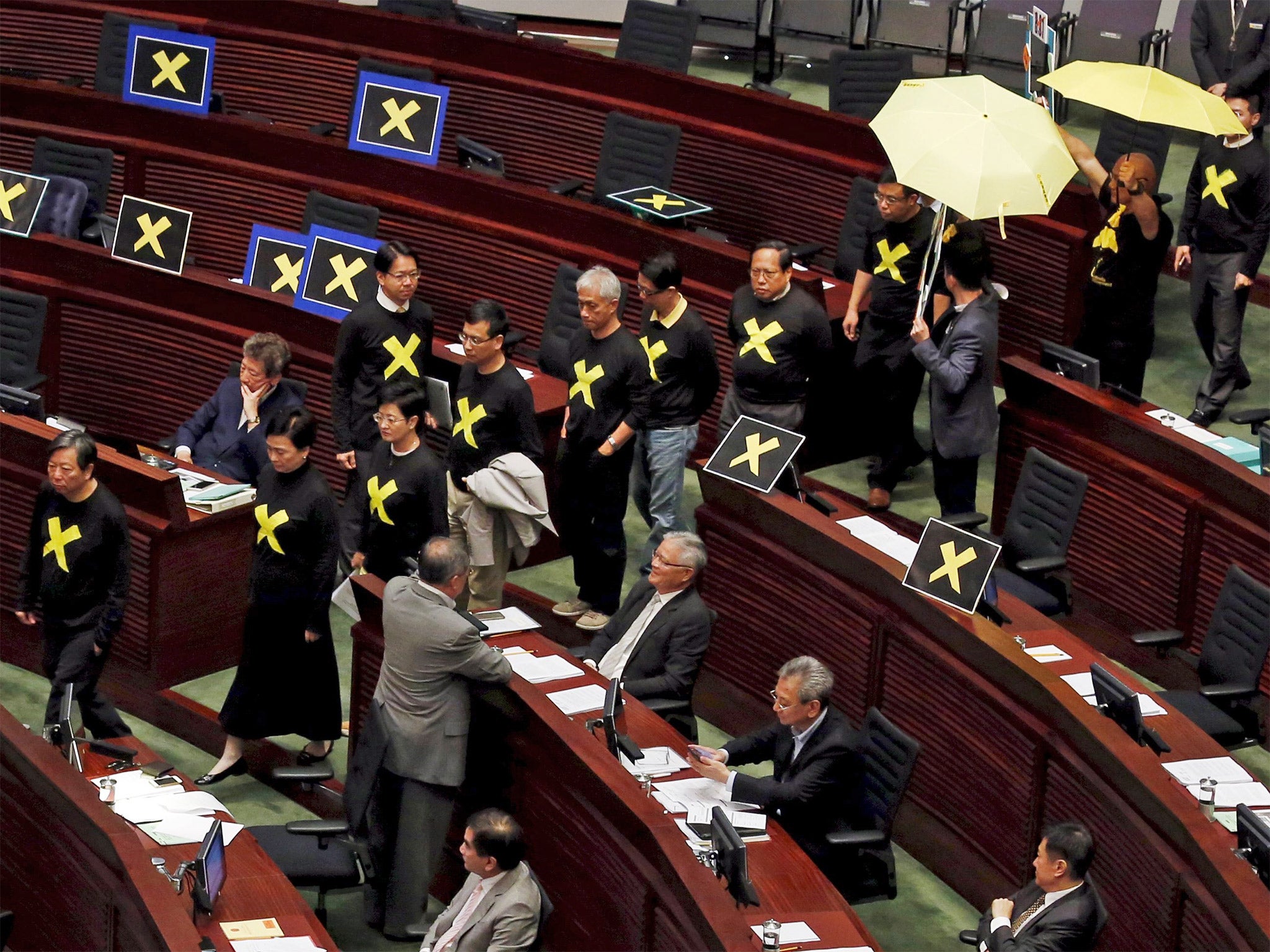 Pro-democracy politicians leave to boycott the Legislative Council meeting in Hong Kong on Wednesday