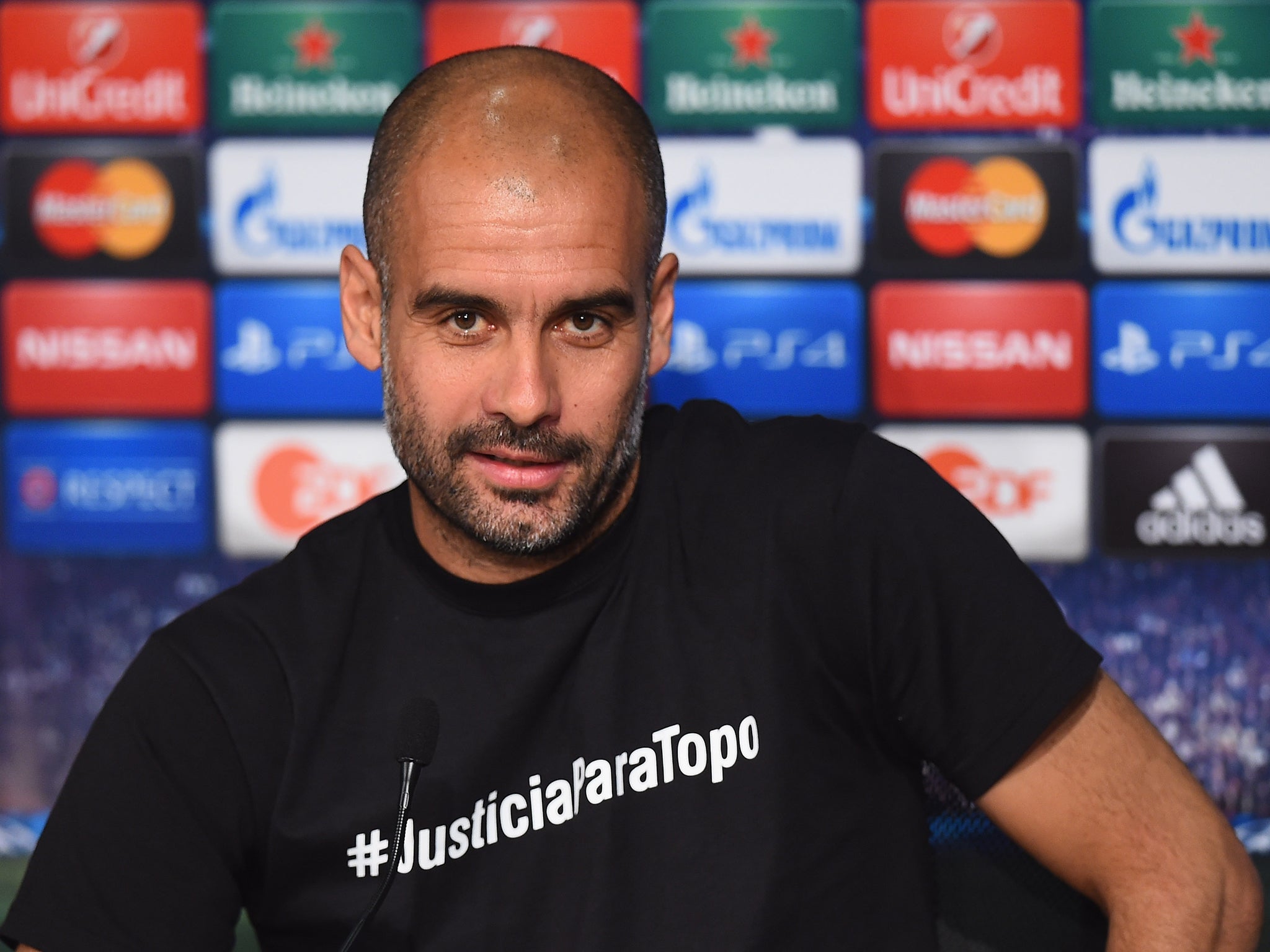 Pep Guardiola wears the offending T-shirt