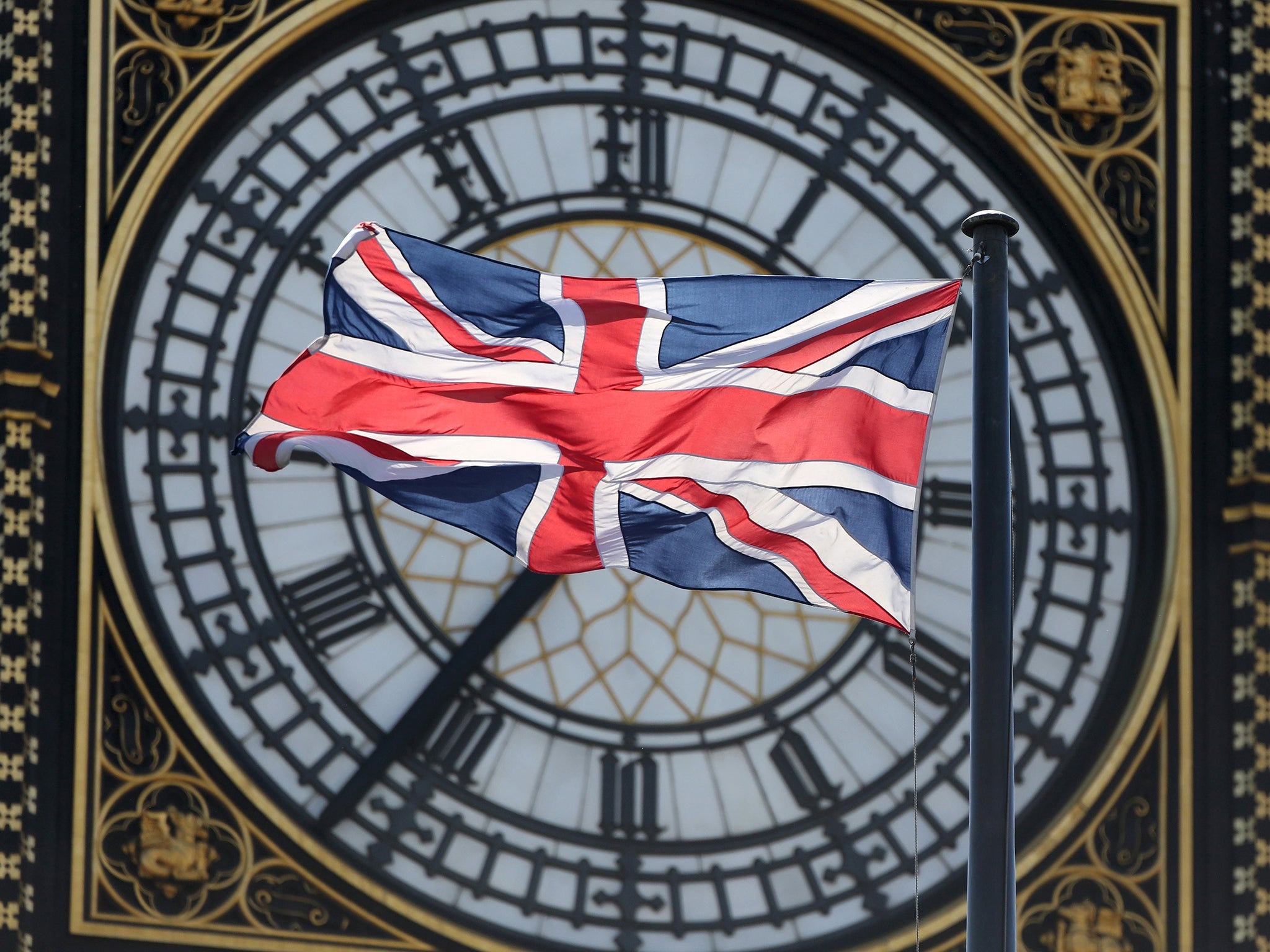 The Union Flag flutters in front of the Big Ben clock tower on the Houses of Parliament in London