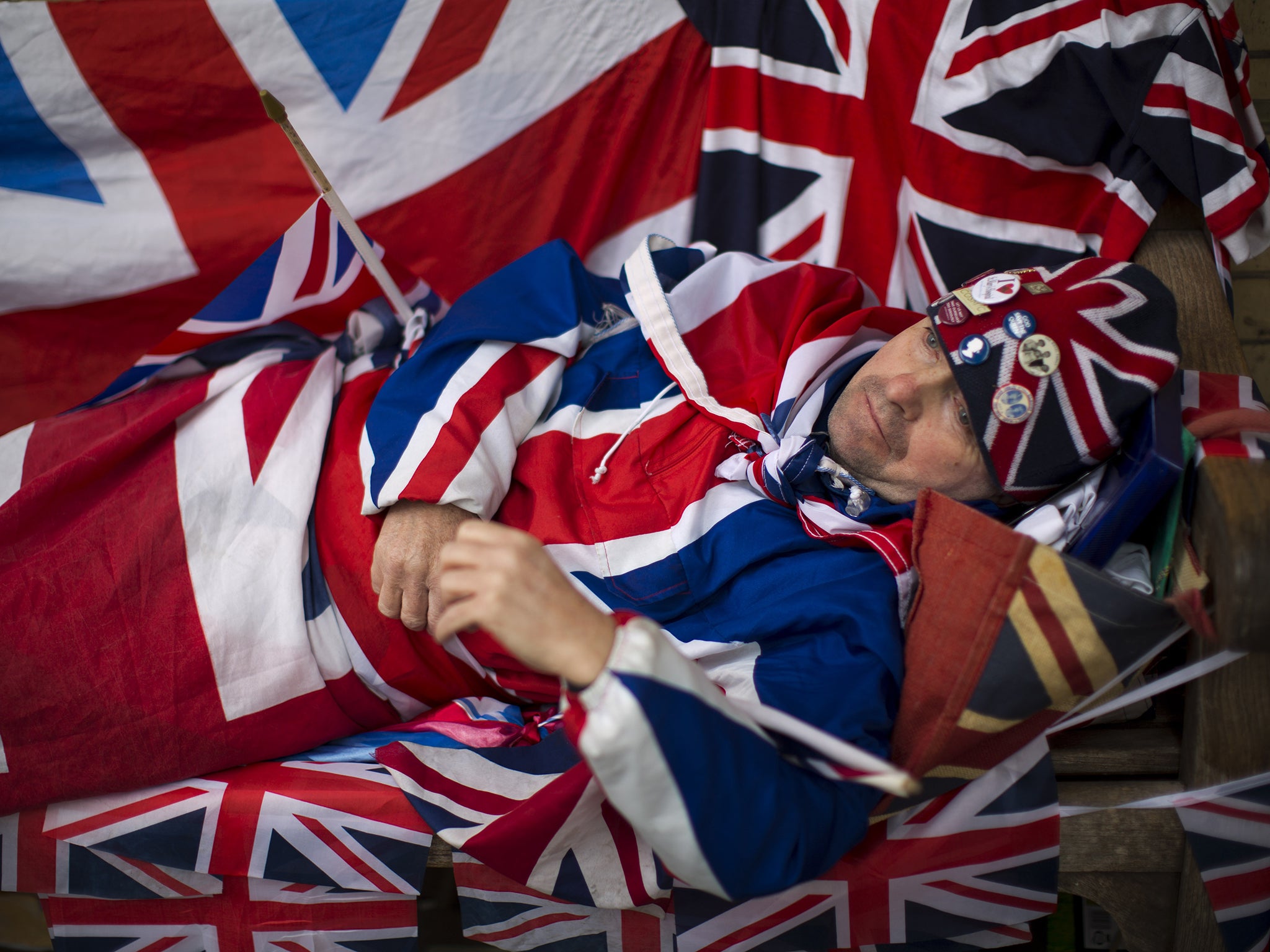 A royal fan dressed in his Union flag outfit and flags has been sleeping on a bench for the last four nights across the street from the Lindo Wing of St Mary's Hospital