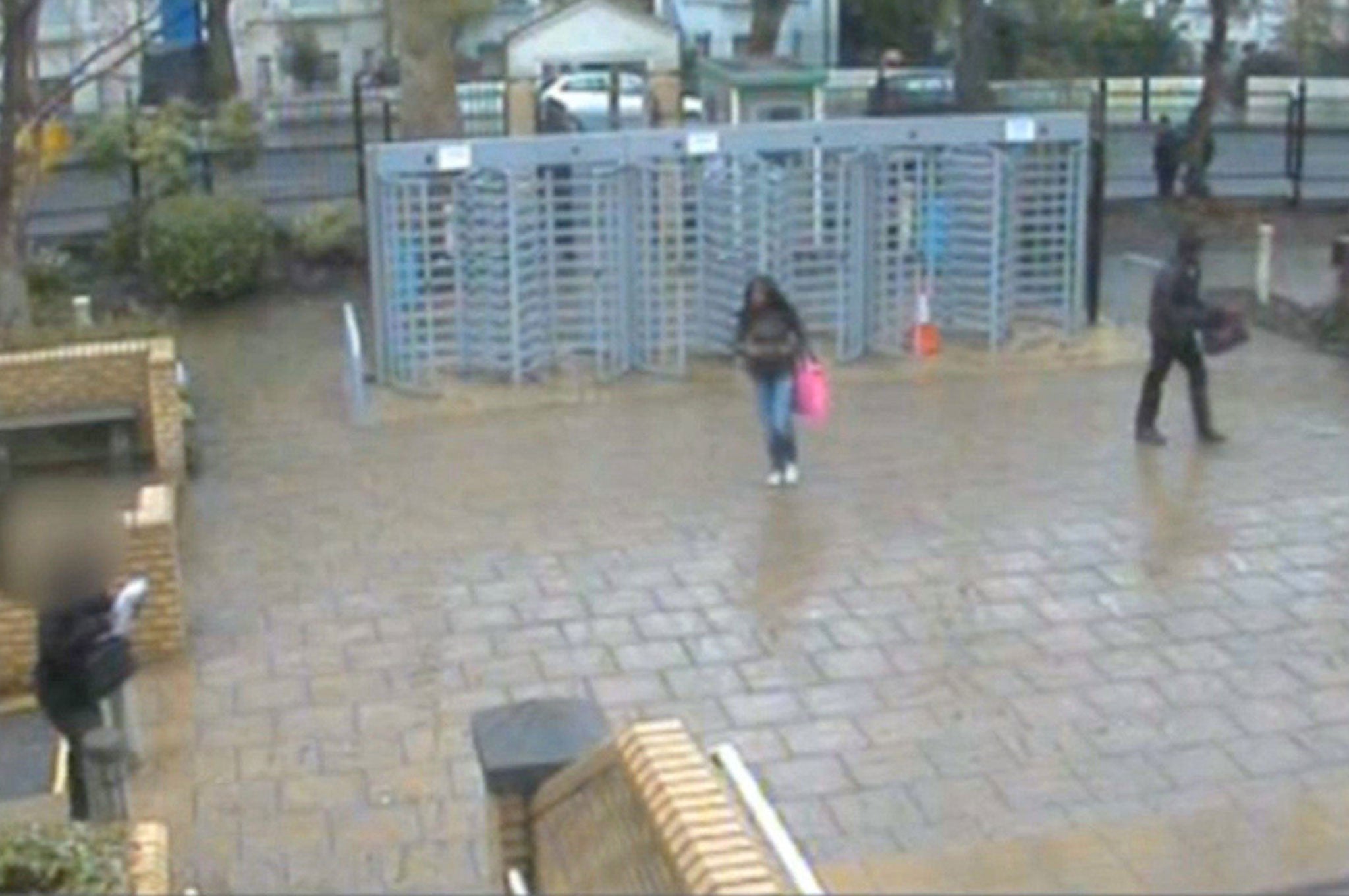 A CCTV image of two of the accused pupils returning to school after buying knives