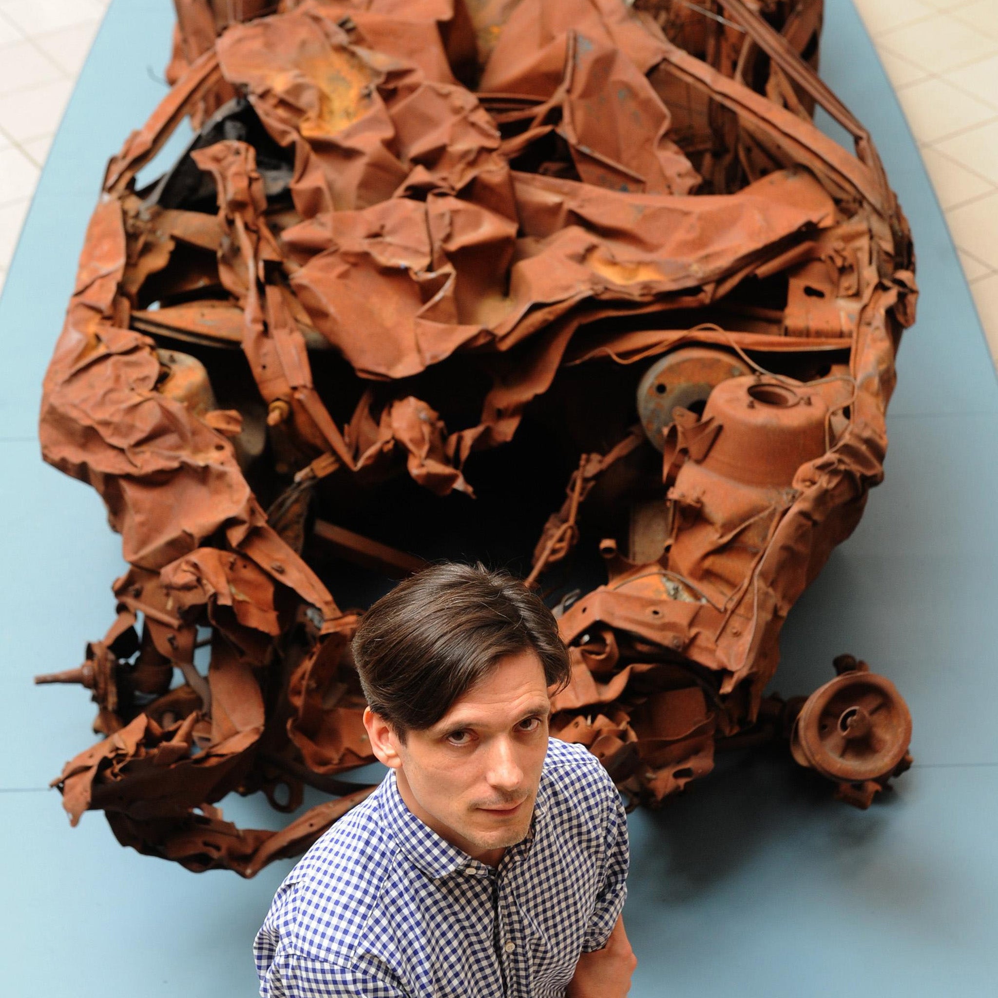 Jeremy Deller with It is What it Is, the shell of a car destroyed by a bomb that killed 38 in Baghdad