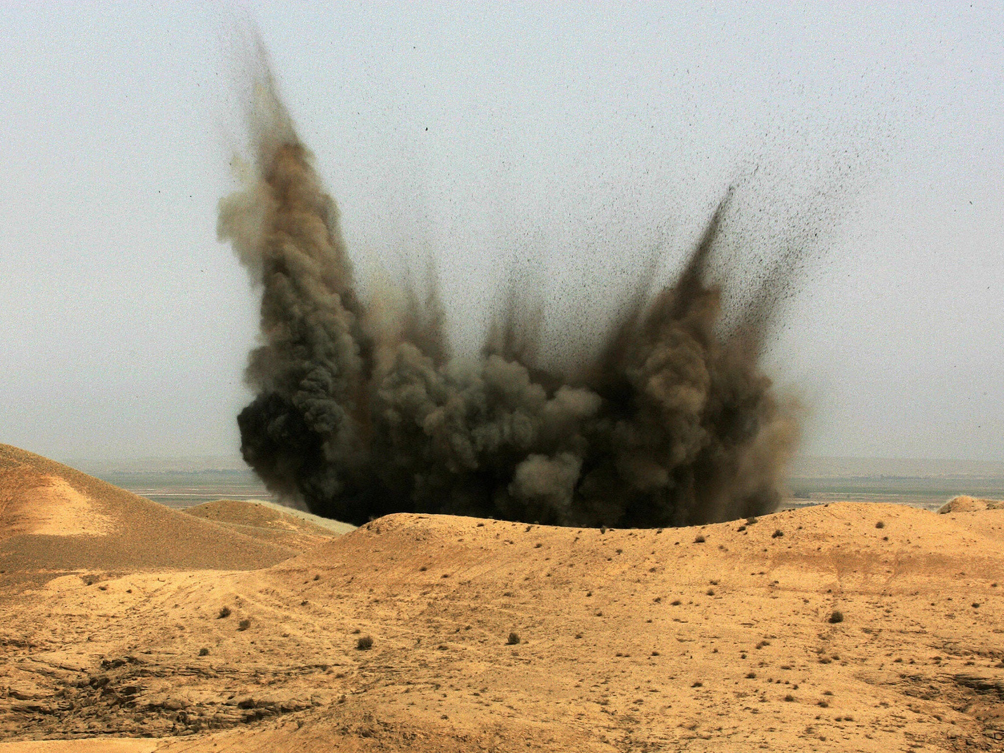 A plume of smoke rises from a US air strike in the deserts of the restive Diyala Province, northeast of Baghdad