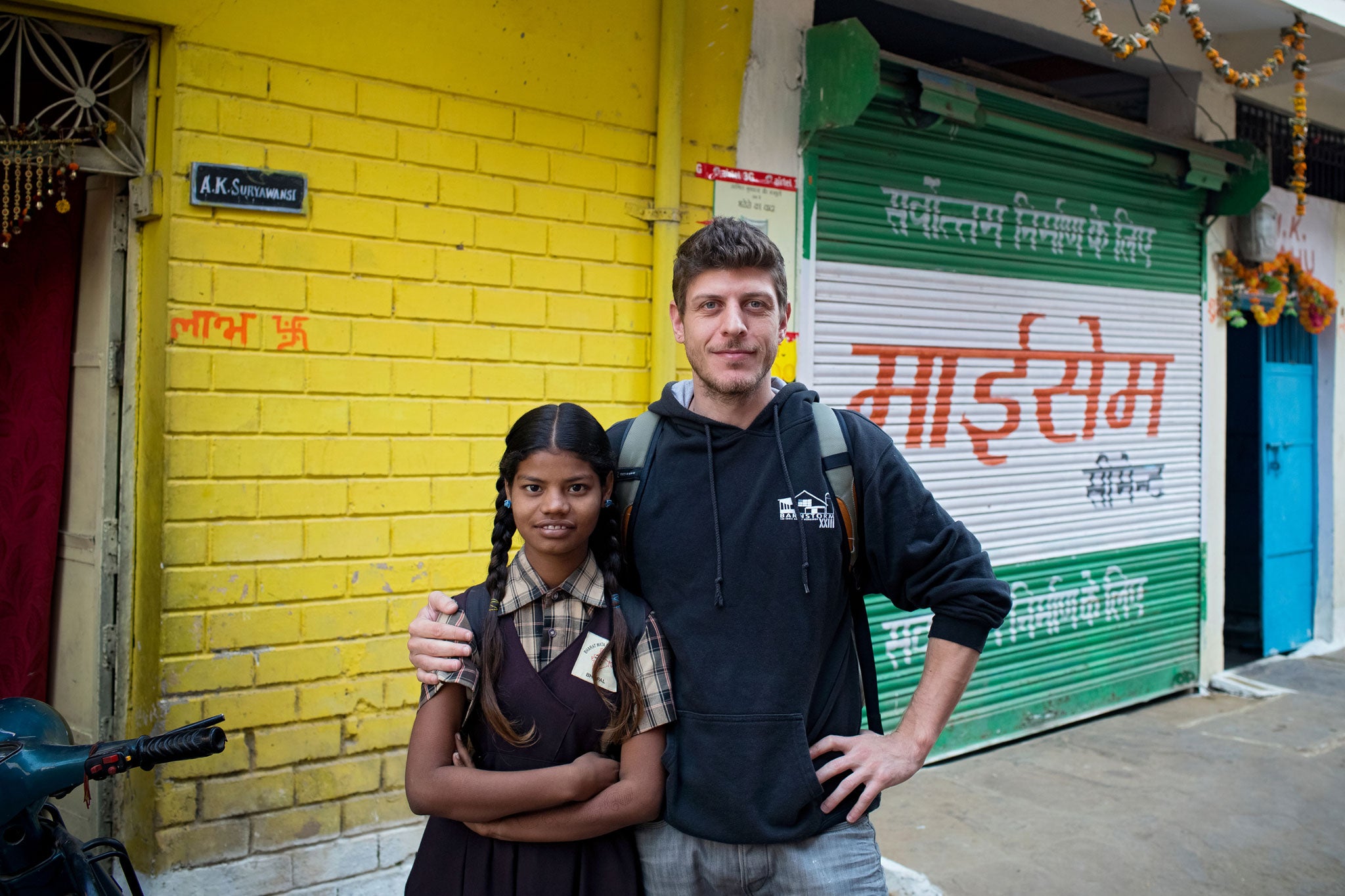 Poonam Jatev, at the start of a school day, with Alex Masi