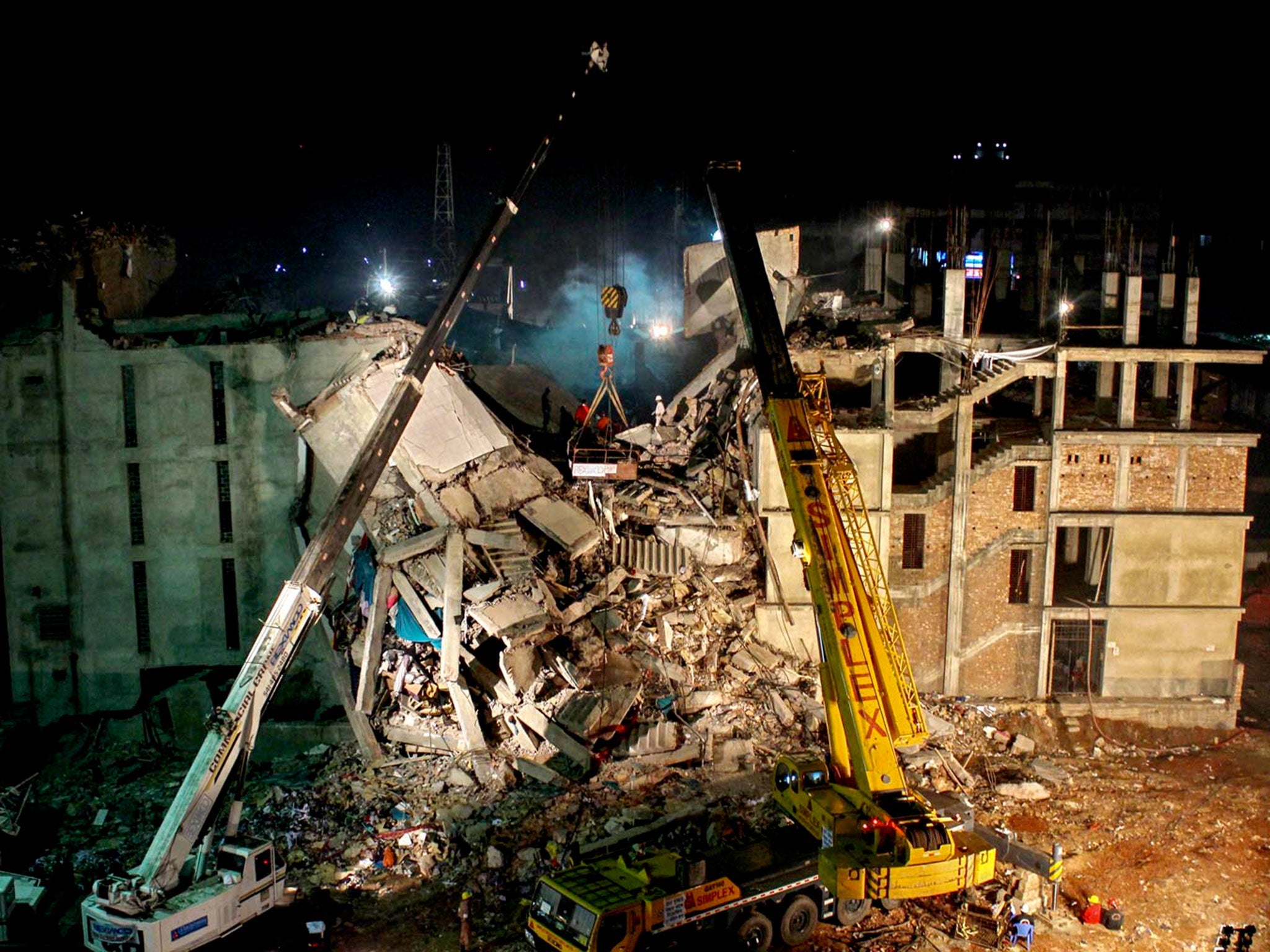 A top view of the wrecked Rana Plaza building that housed several apparel factories producing clothes for US and European brands on the outskirts of Bangladesh capital Dhaka. The deadly factory collapse left over 1,100 workers killed and many more wounded © Farid Ahmed