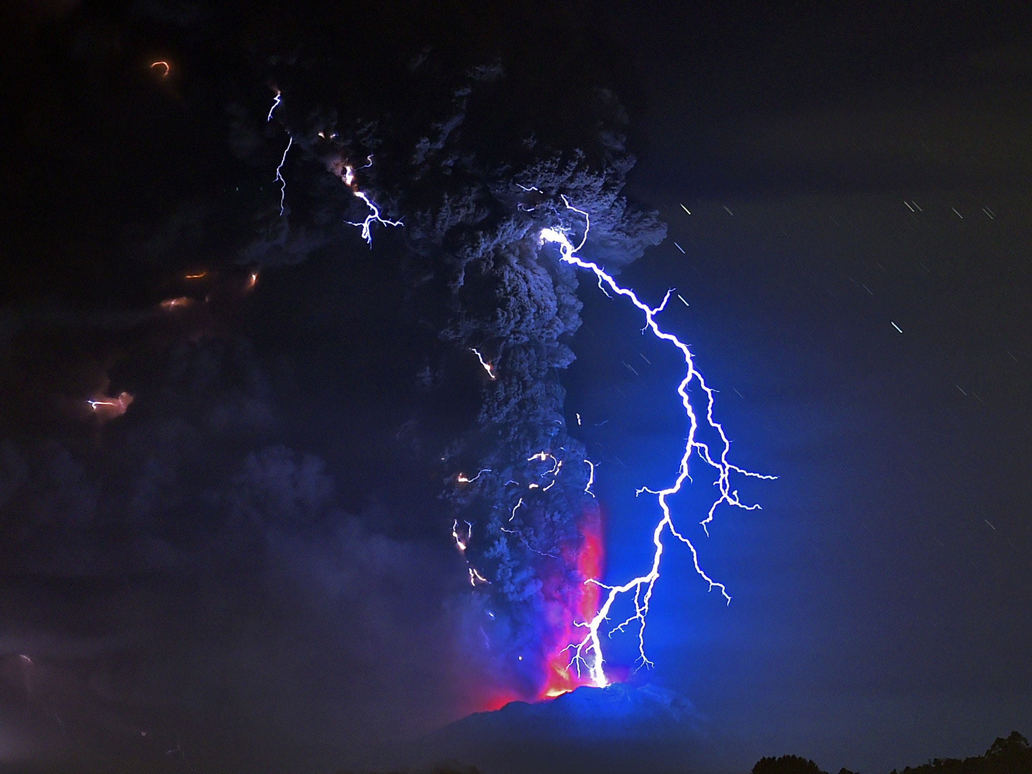 View from Frutillar, southern Chile, of lava spewing from the Calbuco volcano