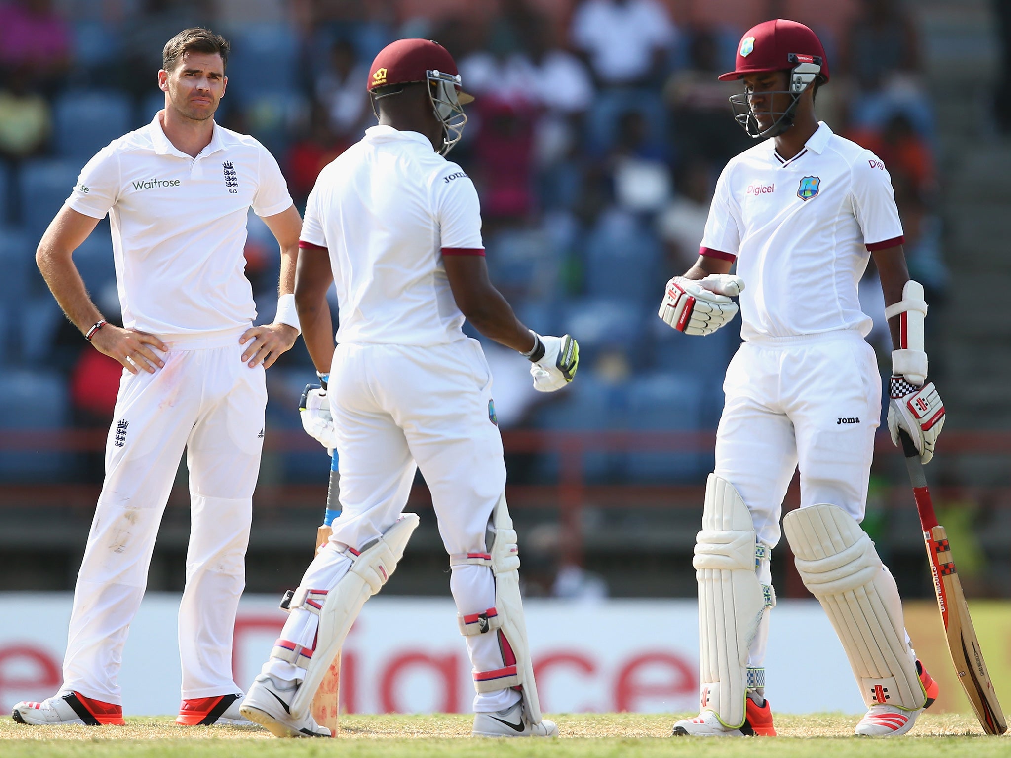 James Anderson (left) shows his frustration as Darren Bravo (centre) and Kraigg Brathwaite (right) defy the England attack