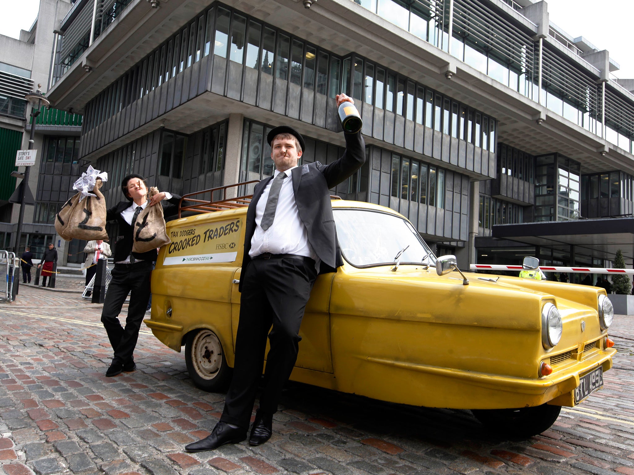 Protestors demonstrate outside a testy HSBC annual general meeting in London