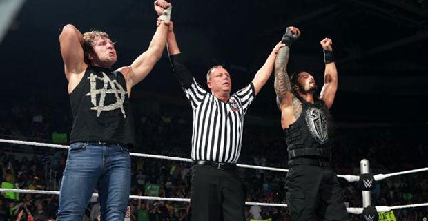 Dean Ambrose and Roman Reigns celebrate their victory