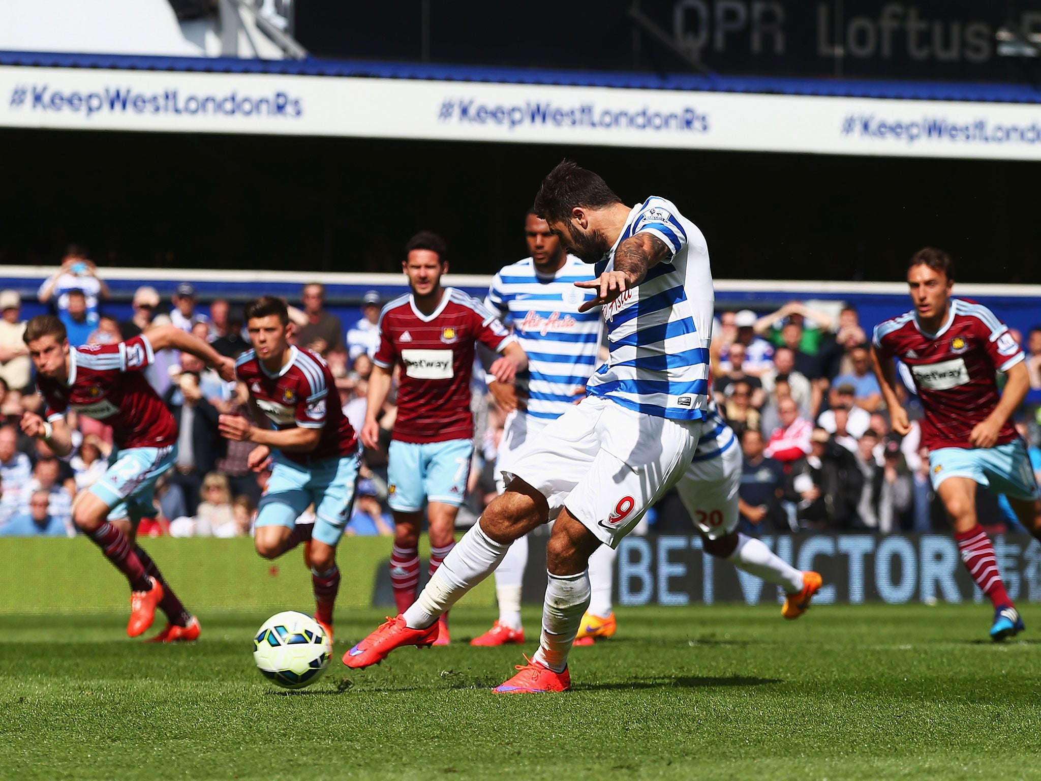 Charlie Austin strikes his penalty for QPR