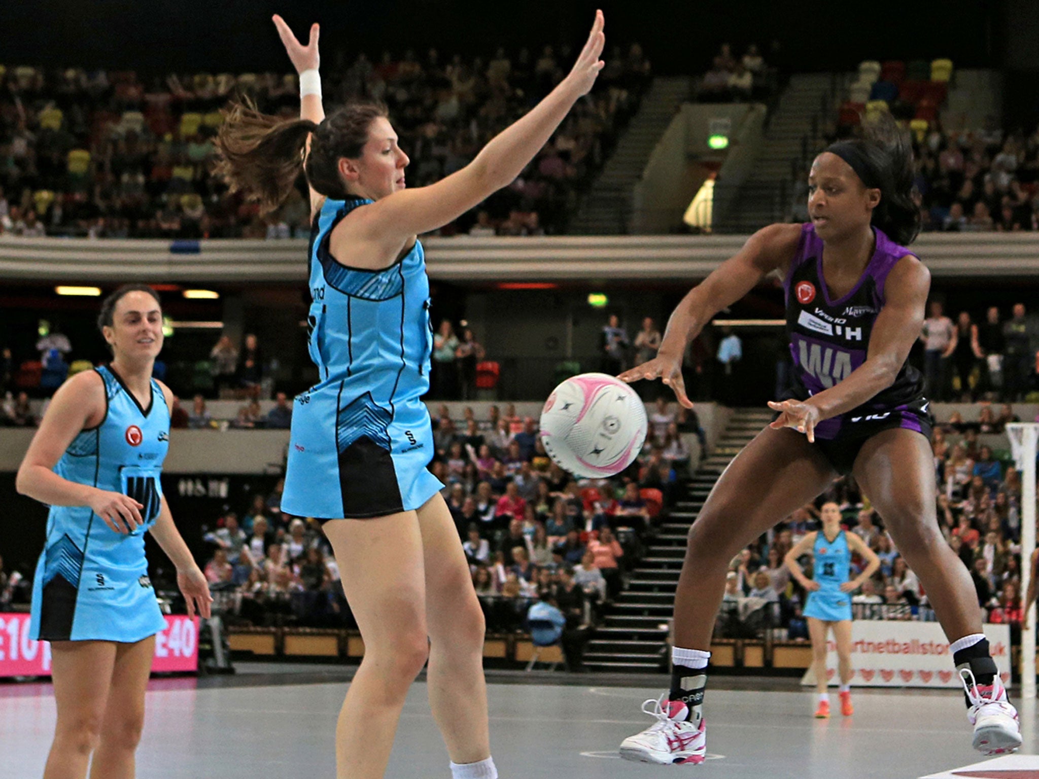 Mavericks’ Sasha Corbin (right) throws under pressure from Storm’s Katy Holland (left)