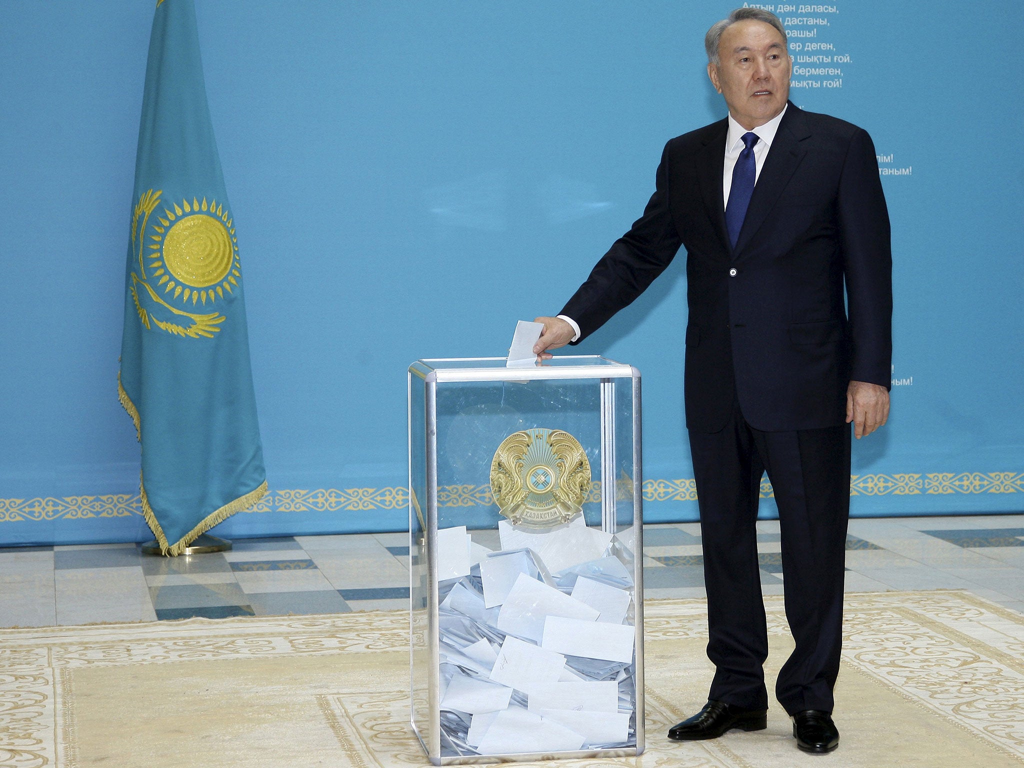 Kazakhstan's President and presidential candidate Nursultan Nazarbayev casts a ballot during a snap presidential election in Astana