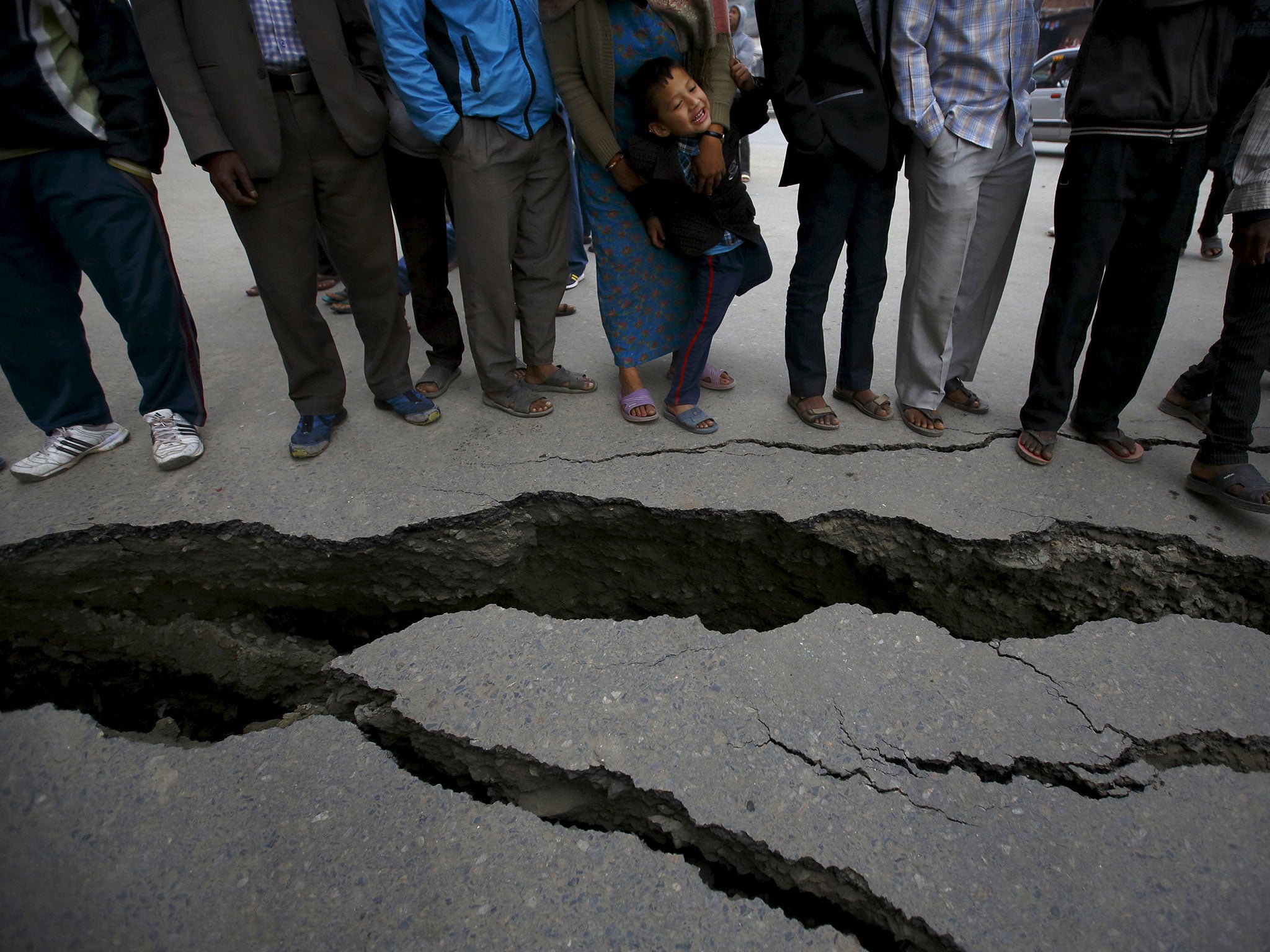 People gather at the cracked road in Bhaktapur