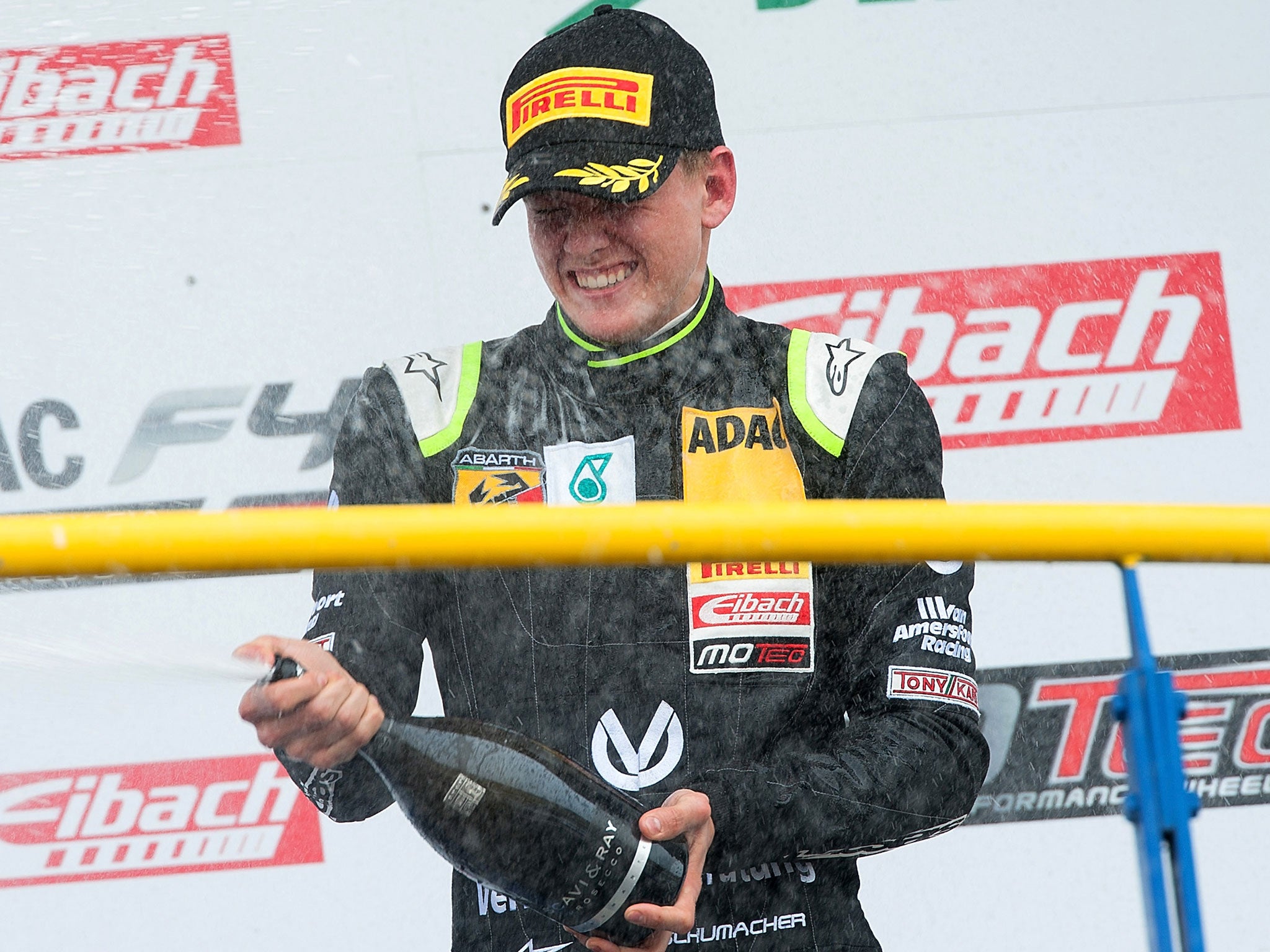 Mick Schumacher celebrates on the podium at Oschersleben